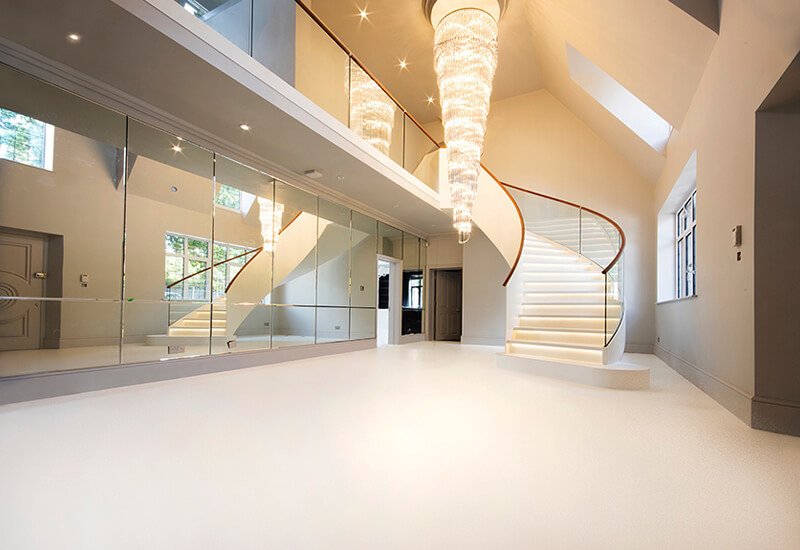 Luxurious interior featuring a seamless white resin floor that creates a bright, airy aesthetic.