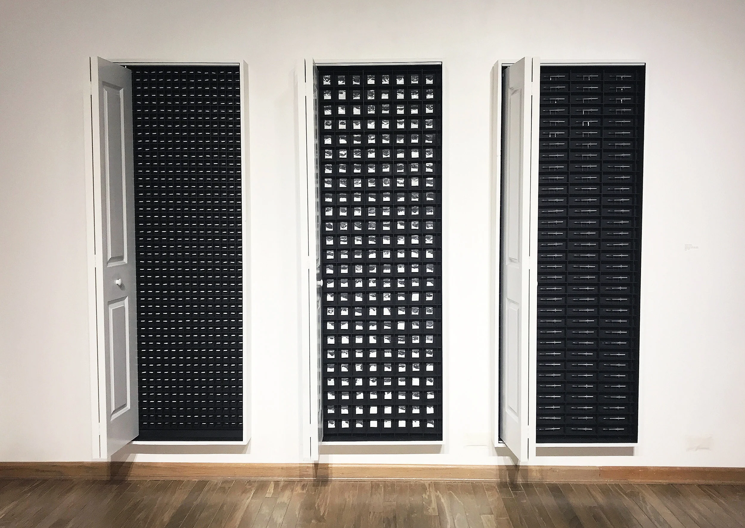 Placebo Triptych 2018 Wood, gelatin capsules, plastic pouch, syringe, paint, steel, foam core This is the final iteration of the concepts explored within the placebo series that launched early in my art making. The concept behind this piece is self medication and the cyclical futility of trying to escape the shame of being gay. Internalized self-hatred and homophobia plague members of the LGBTQ+ community, specifically those struggling with being in the closet. The risk of drug and alcohol dependency amongst sexual minority groups is over twice the amount of their heterosexual counterparts. The concept highlights the need for self acceptance and the futility of trying to cure oneself of a perceived illness.