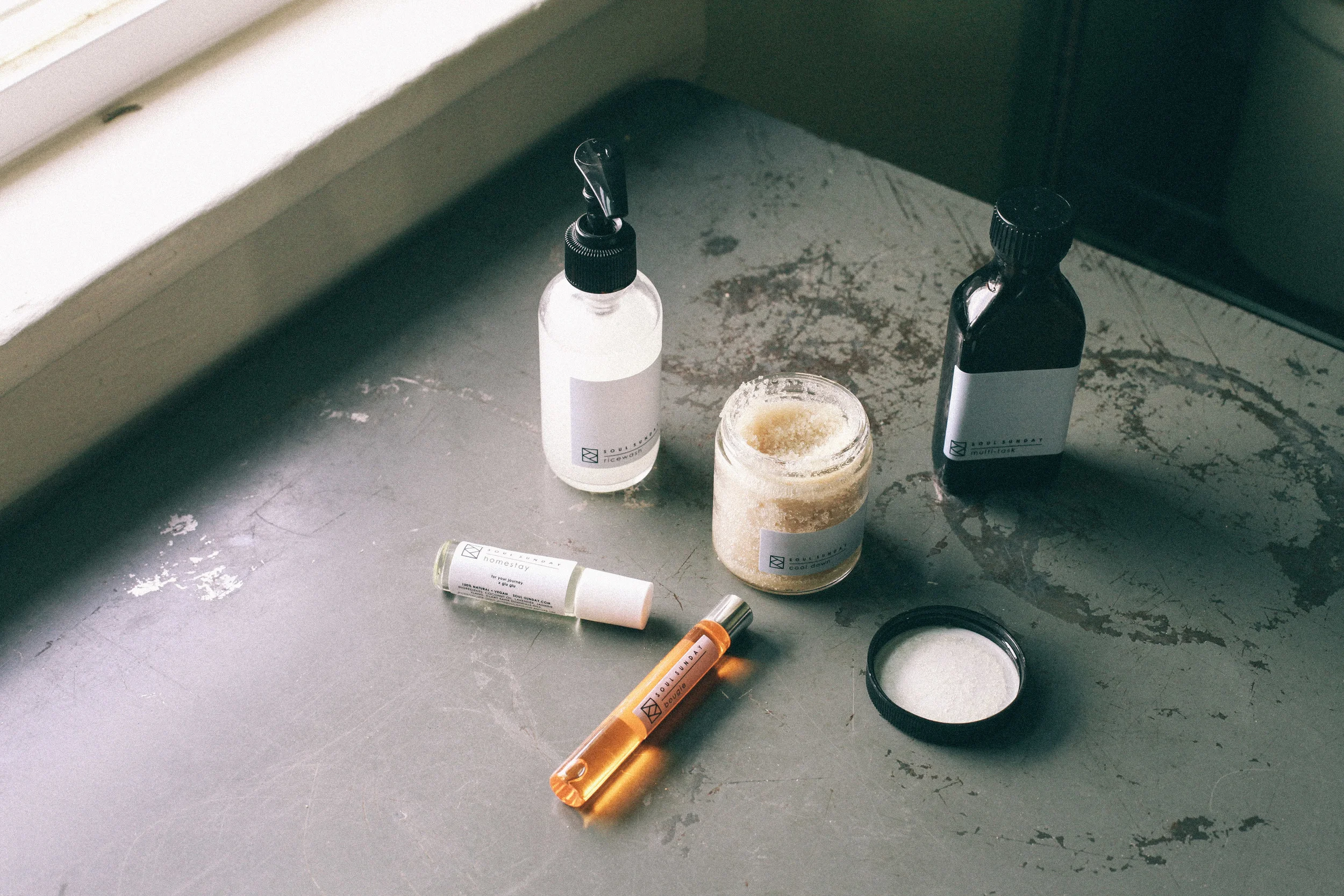Soul Sunday is a vegan and small-batch apothecary out of Massachusetts. Ingredients matter so we want to give mom the best her skin can have. Pictured above is Soul Sunday 's ricewash facial cleanser , multi-task body + shave oil , bougie facial oi l, cool down sugar scrub , and homestay aromatherapy roller . The natural scents of these products are heavenly and the ingredients are food for the skin. 