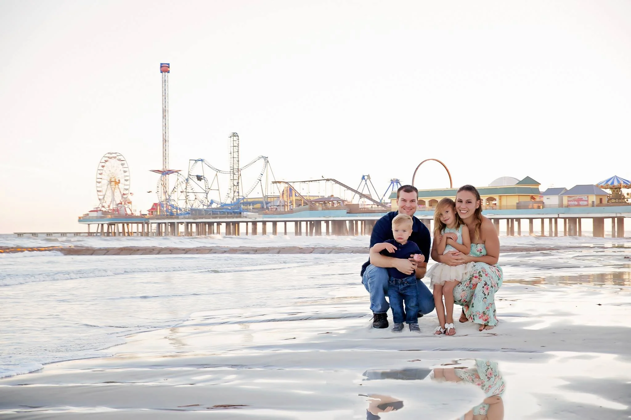 Christy of Inspired By You Photography enjoying a beach vacation with her husband and children.