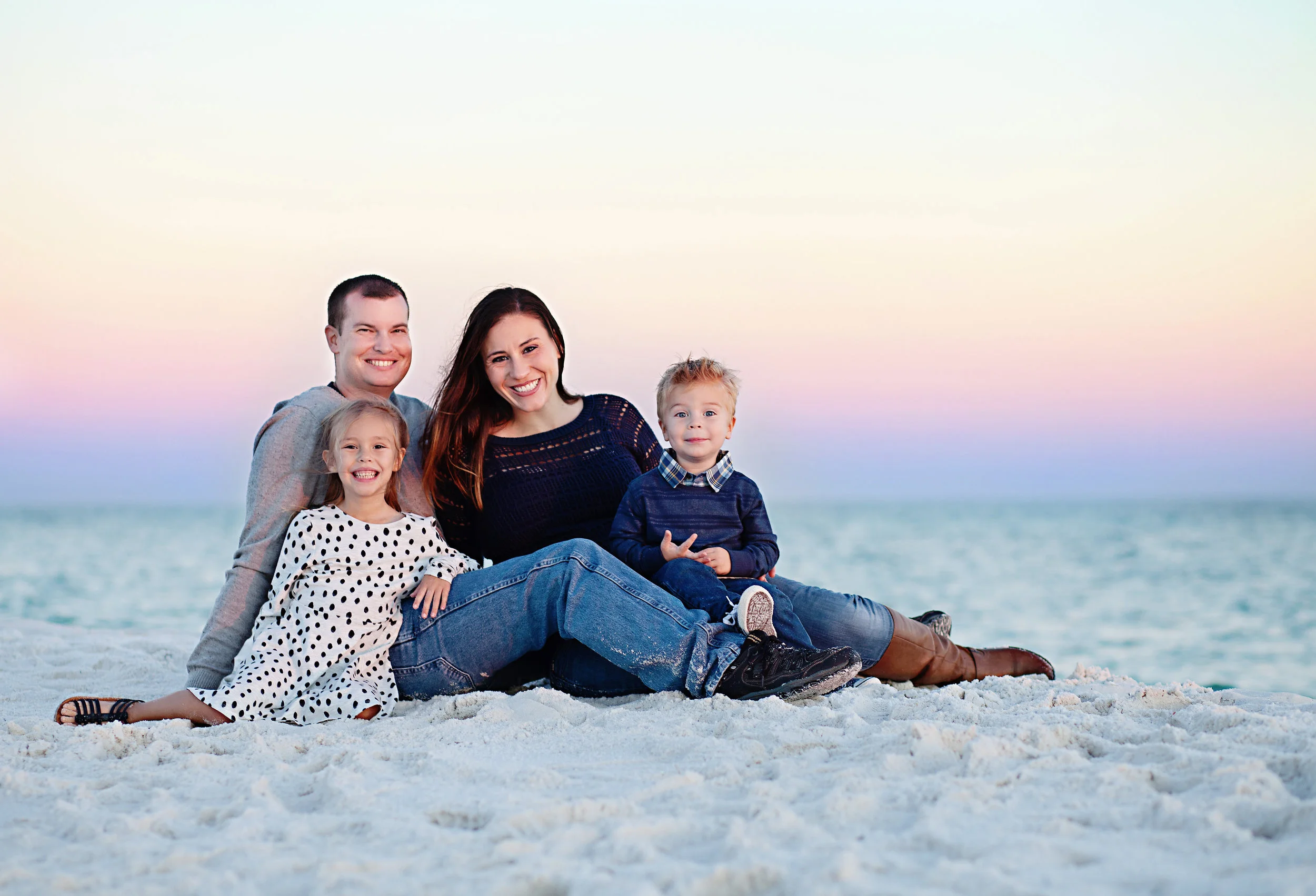 Christy of Inspired By You Photography with her family on Navarre Beach, where she photographs families, seniors, couples and special occasions.