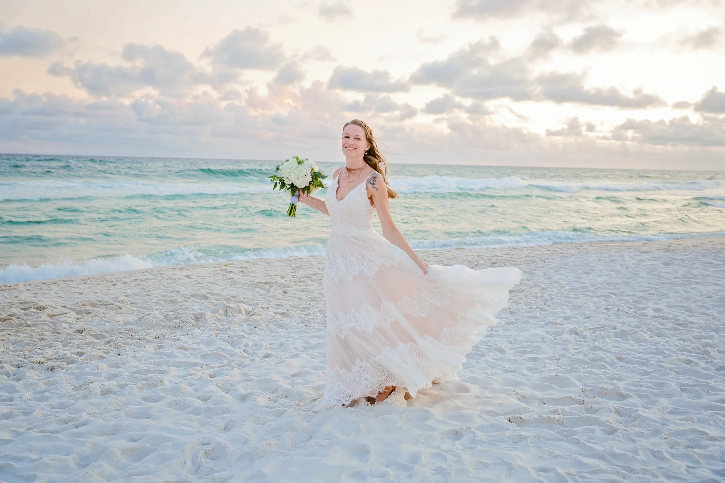 beautiful bride dancing on the white sand beach of rosemary beach Florida photographed by Jacksonville, St. Augustine Florida Photographer