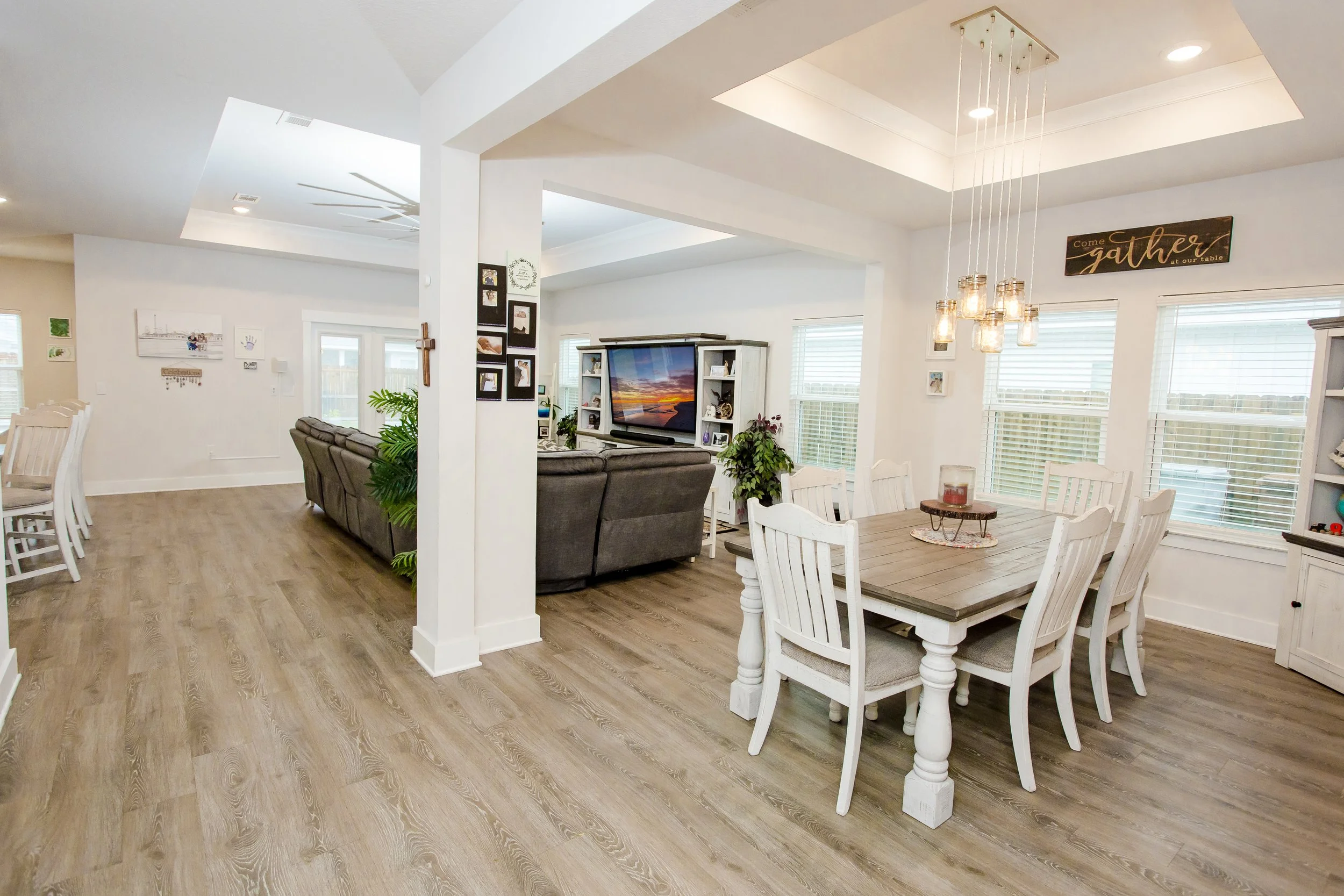 Professional real estate interior photography featuring a bright open-concept dining and living area
