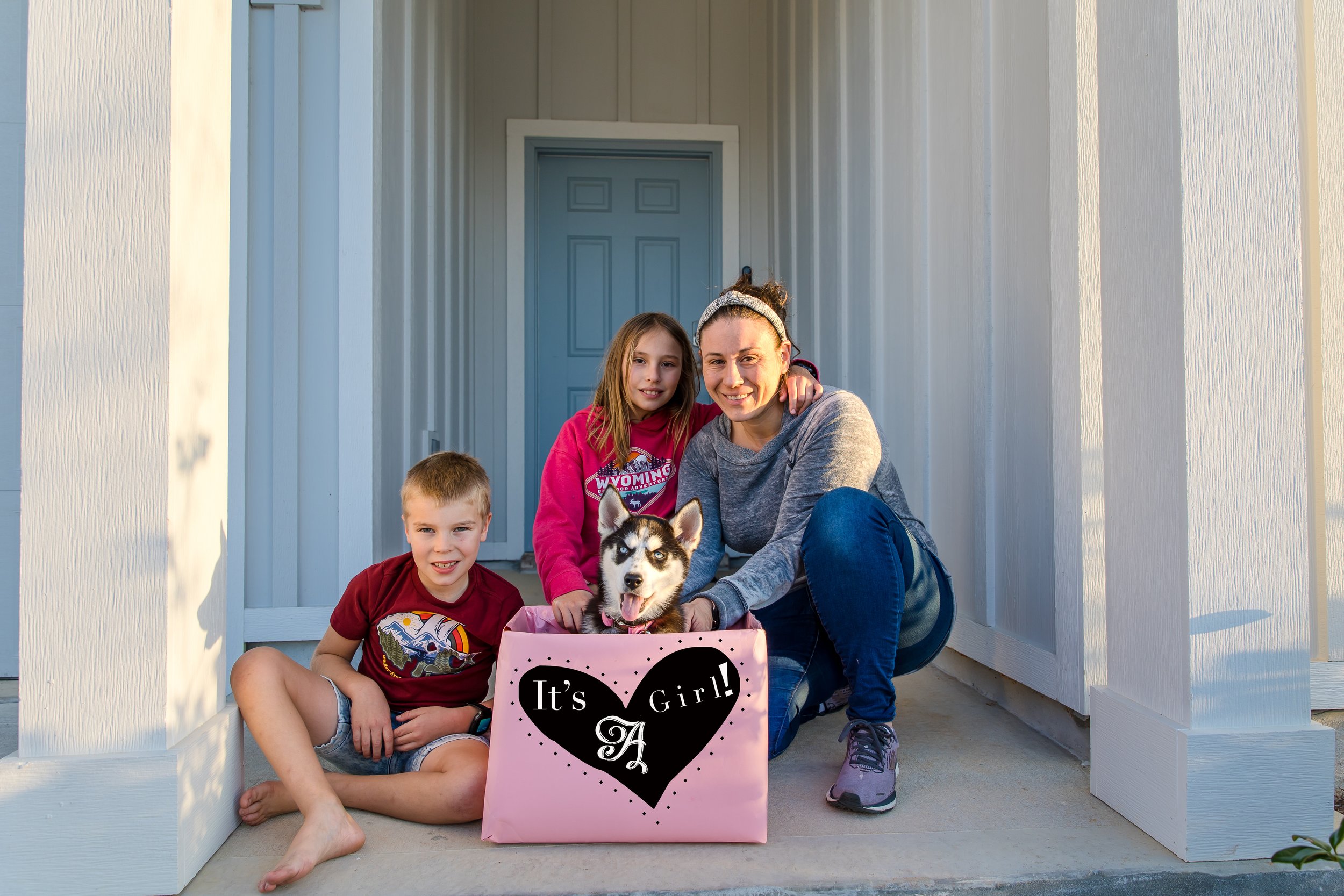 Christy of Inspired By You Photography with her children and family dog at home in Florida.