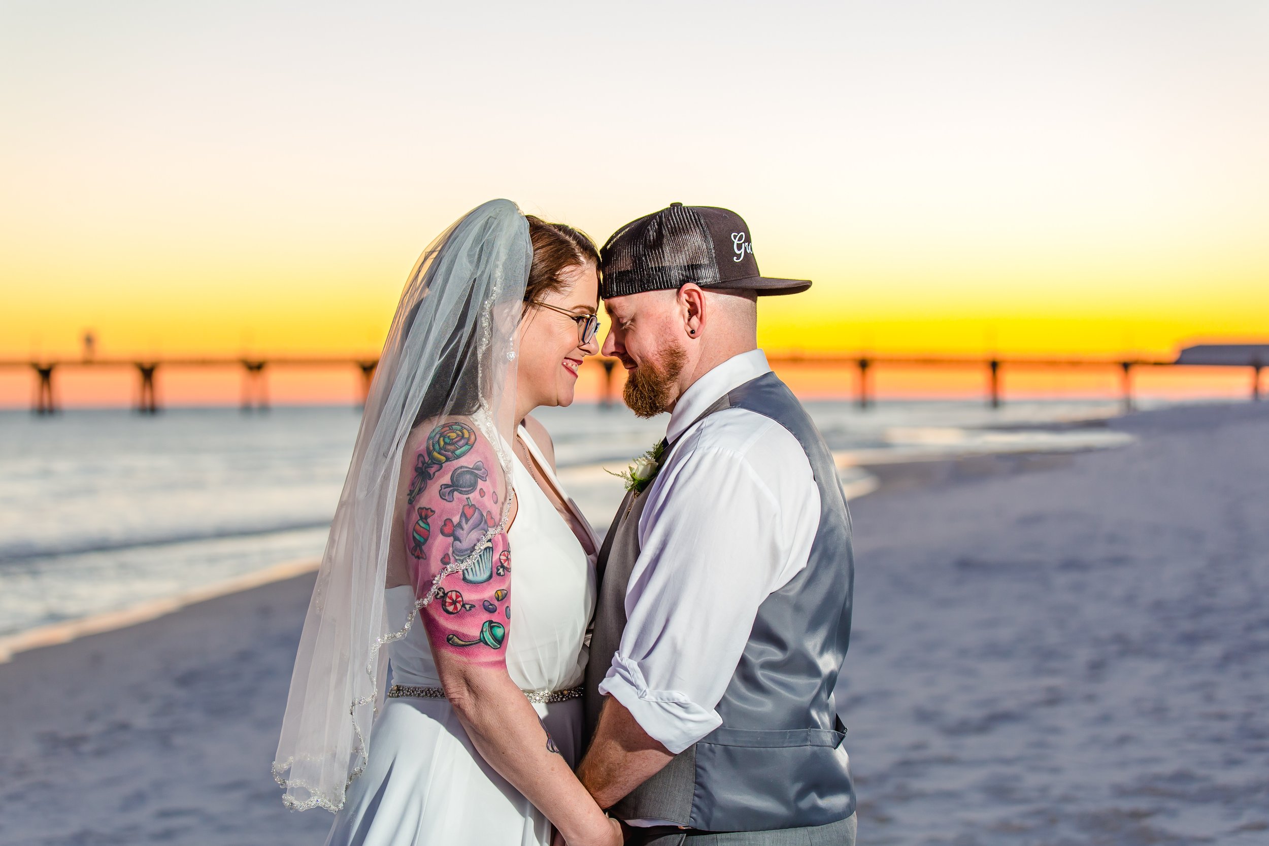 bride and groom Sunset embrace on Fort Walton Beach Florida white sandy Beach Picture taken by a Jacksonville and St. Augustine Florida Photographer