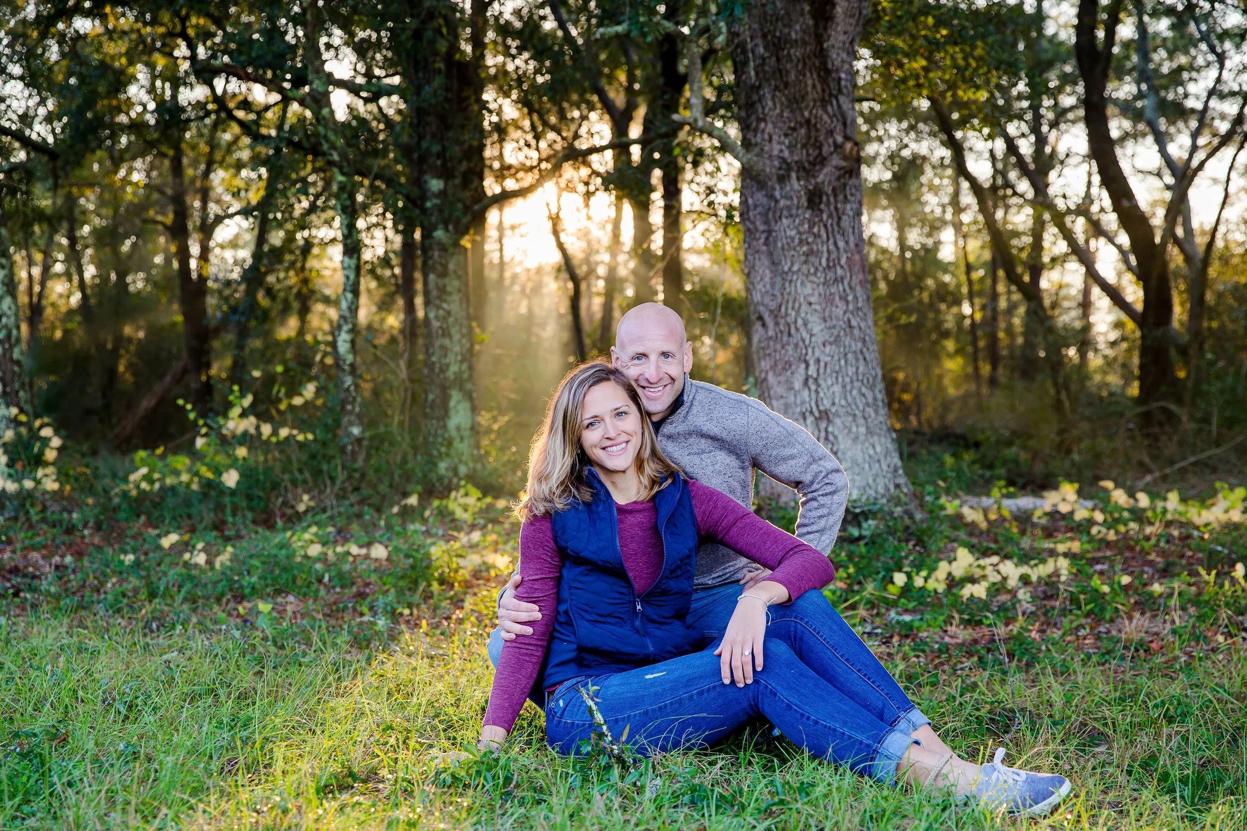 Couple engaged posing for a pictured in a park in Jacksonville Florida