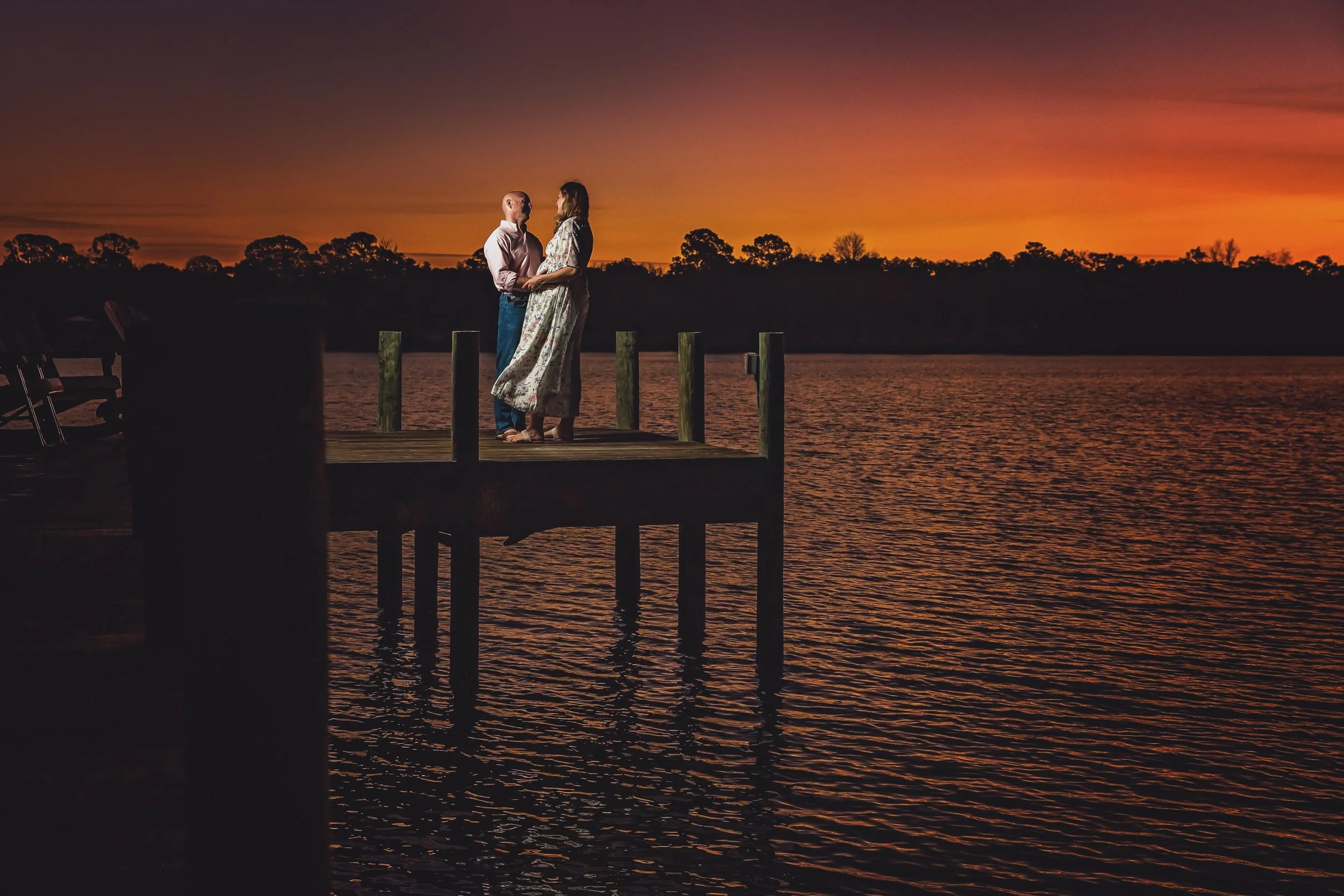 pregnancy pictures with a couple at sunset in Jacksonville beach Florida