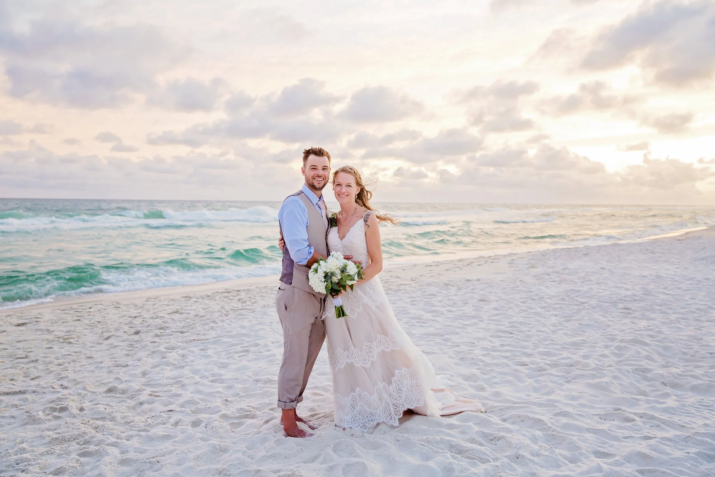 beautiful bride and groom standing on the white sand beach of rosemary beach Florida photographed by Jacksonville, St. Augustine Florida Photographer