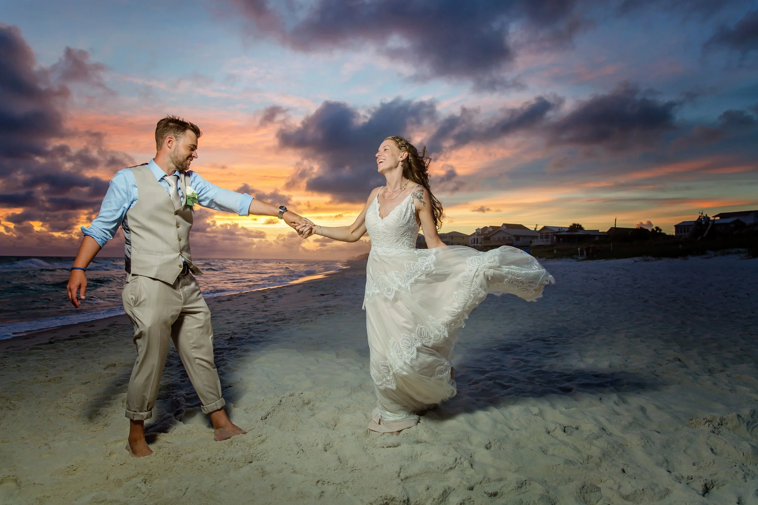 Brad and groom dancing on the white sand beach of rosemary beach Florida photographed by Jacksonville, St. Augustine Florida Photographer