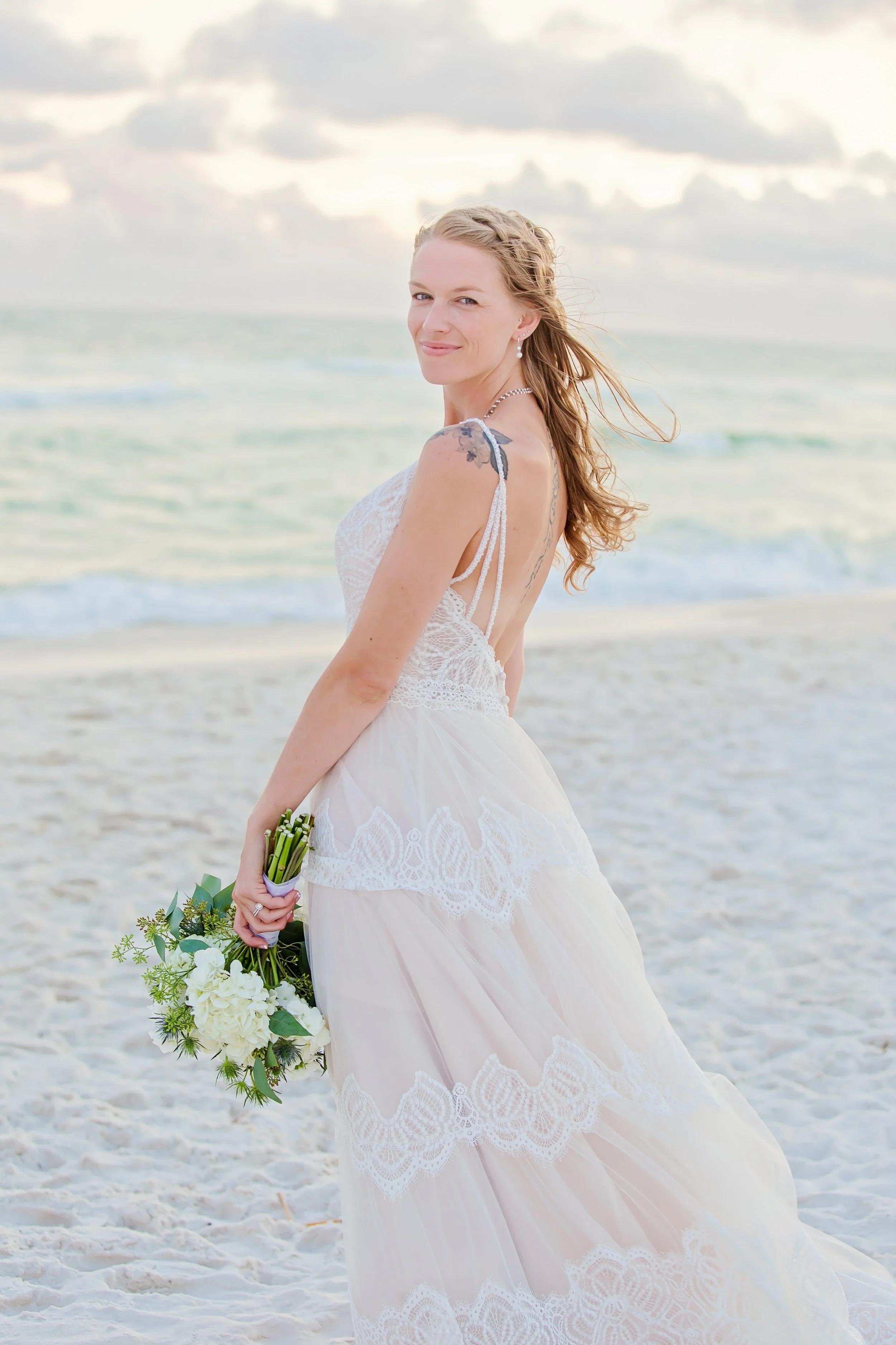 beautiful bride standing on the white sand beach of rosemary beach Florida photographed by Jacksonville, St. Augustine Florida Photographer
