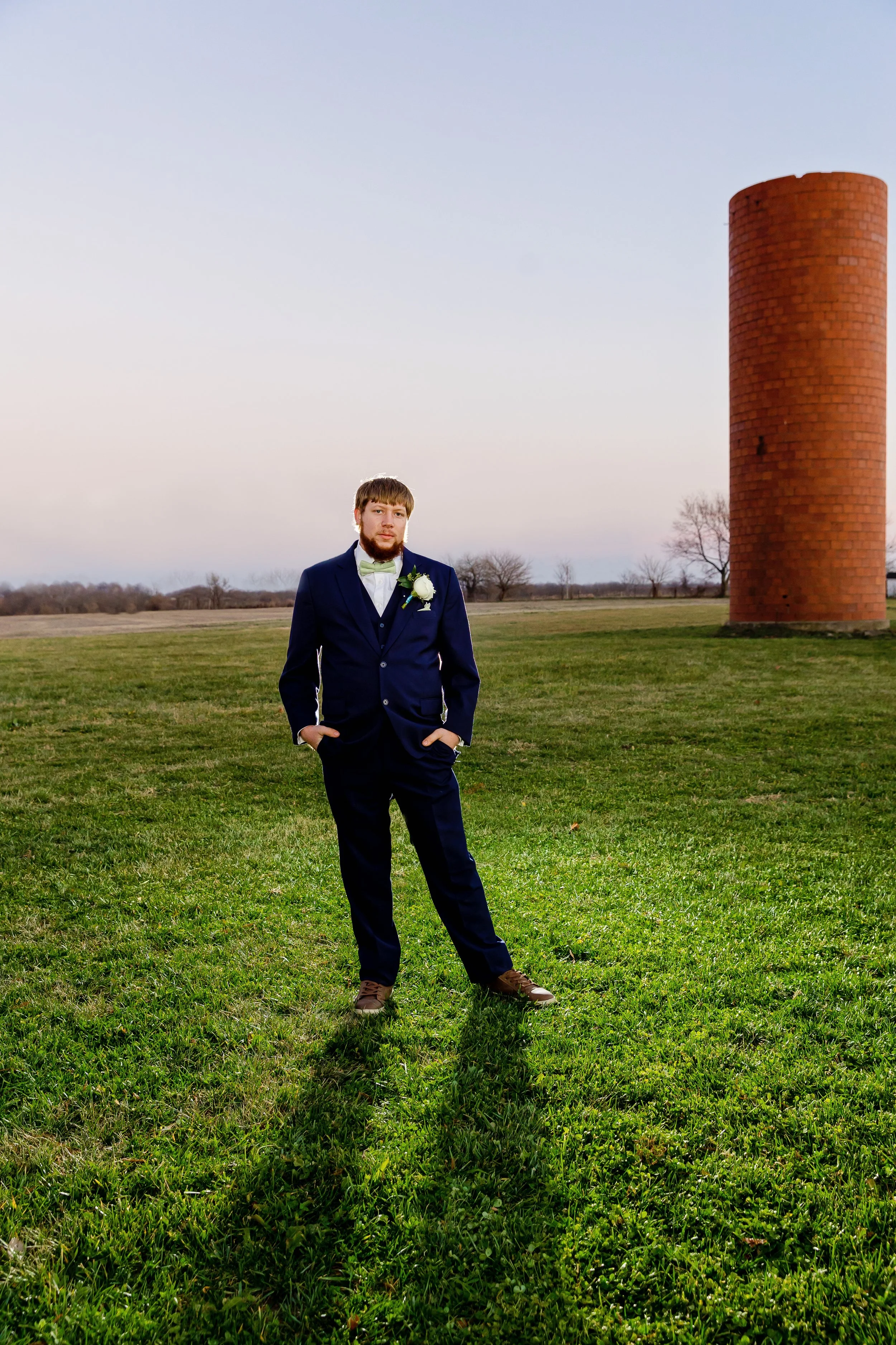 Handsome groom portraits in a country field photo captured by Jacksonville beach St. Augustine Florida wedding photographer