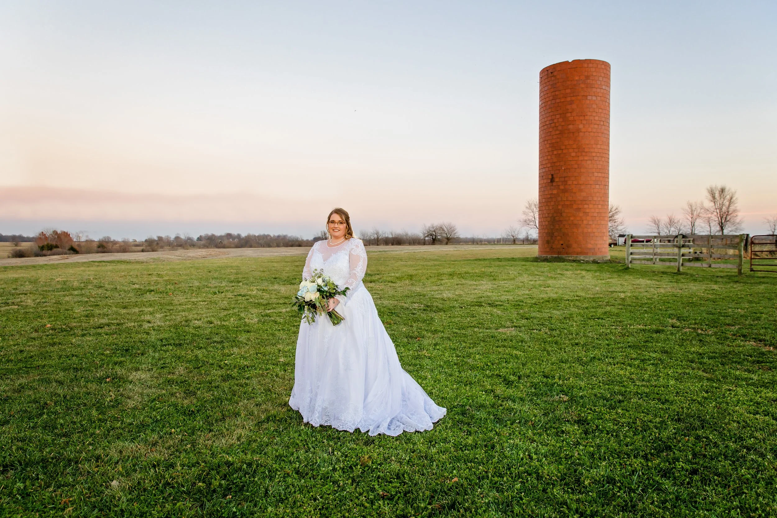 A gorgeous bride portraits in a country field photo captured by Jacksonville beach St. Augustine Florida wedding photographer