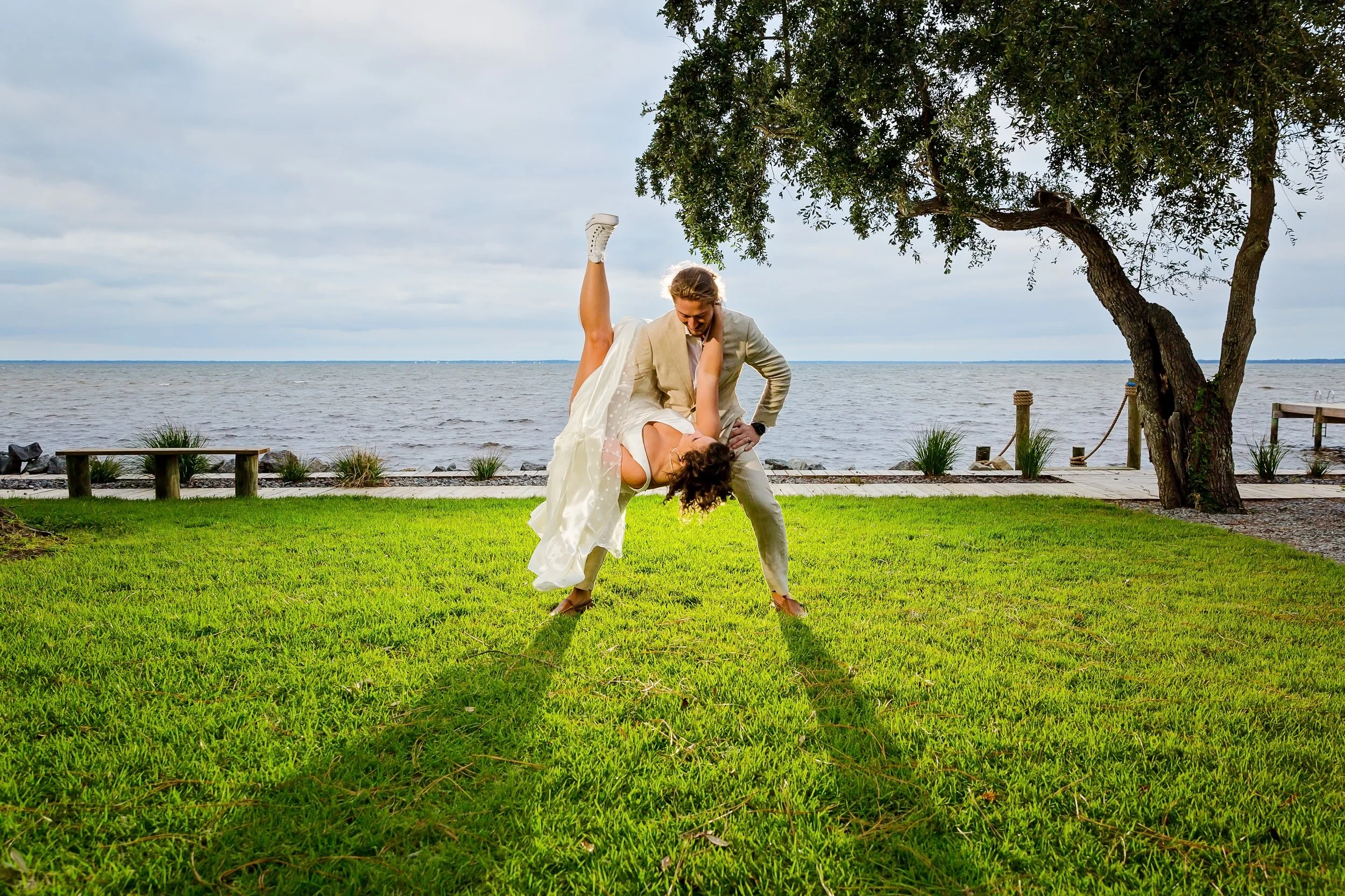 Bride and Groom dancing under a tree at the Bay Front Lodge and Log Cabin in Gulf Breeze Florida photographed by Jacksonville beach and St. Augustine Florida photographer
