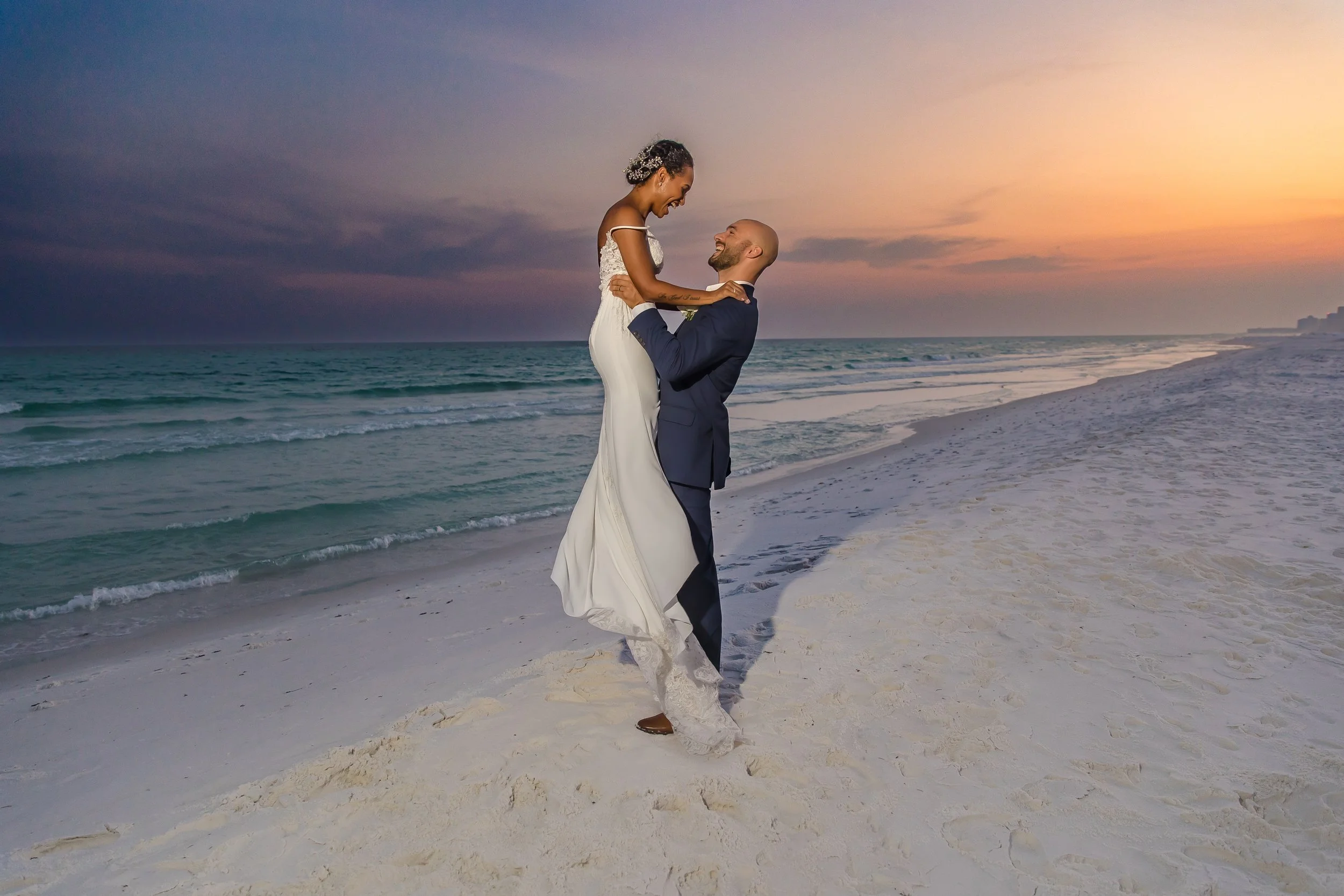 Bride and groom on the white sand beaches of Henderson Beach Florida Picture taken by St. Augustine and Jacksonville Florida wedding photographer