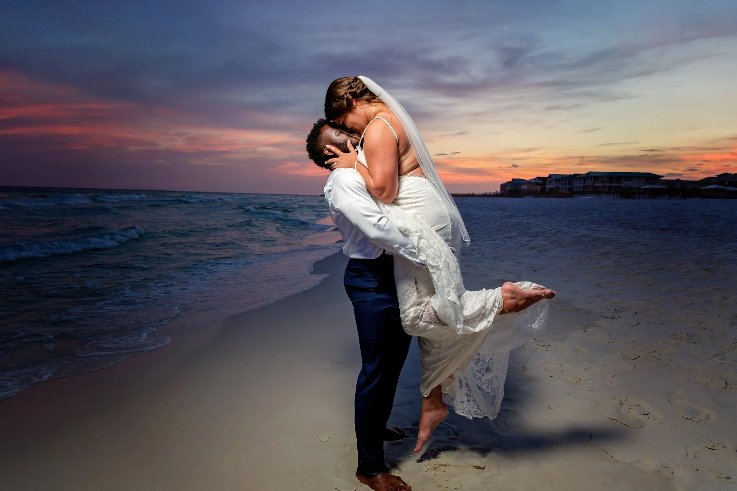 Bride and groom embrace on white sandy Destin beaches. Photographed by St Augustine and Jacksonville Florida Wedding photographer