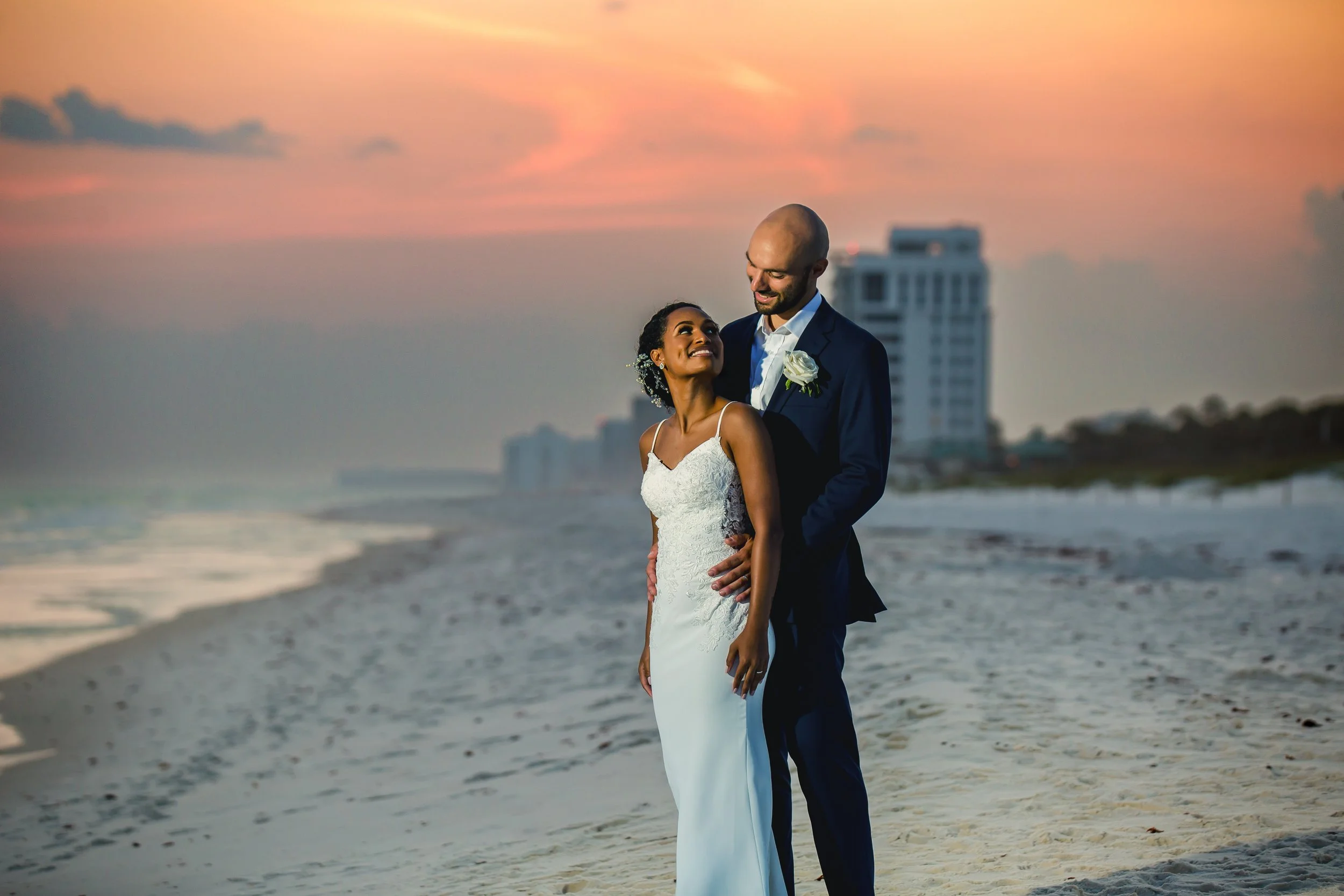 Bride and groom on the white sand beaches of Henderson Beach Florida Picture taken by St. Augustine and Jacksonville Florida wedding photographer