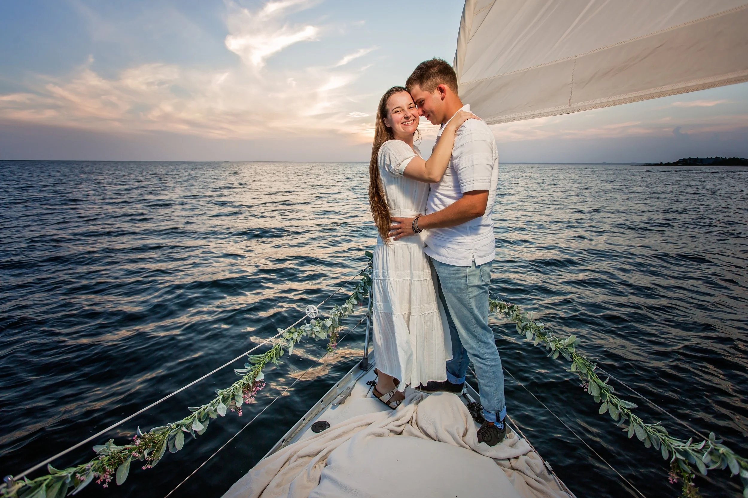 couple on Adventure Sailing Tours in Pensacola engagement photoshoot Jacksonville beach.