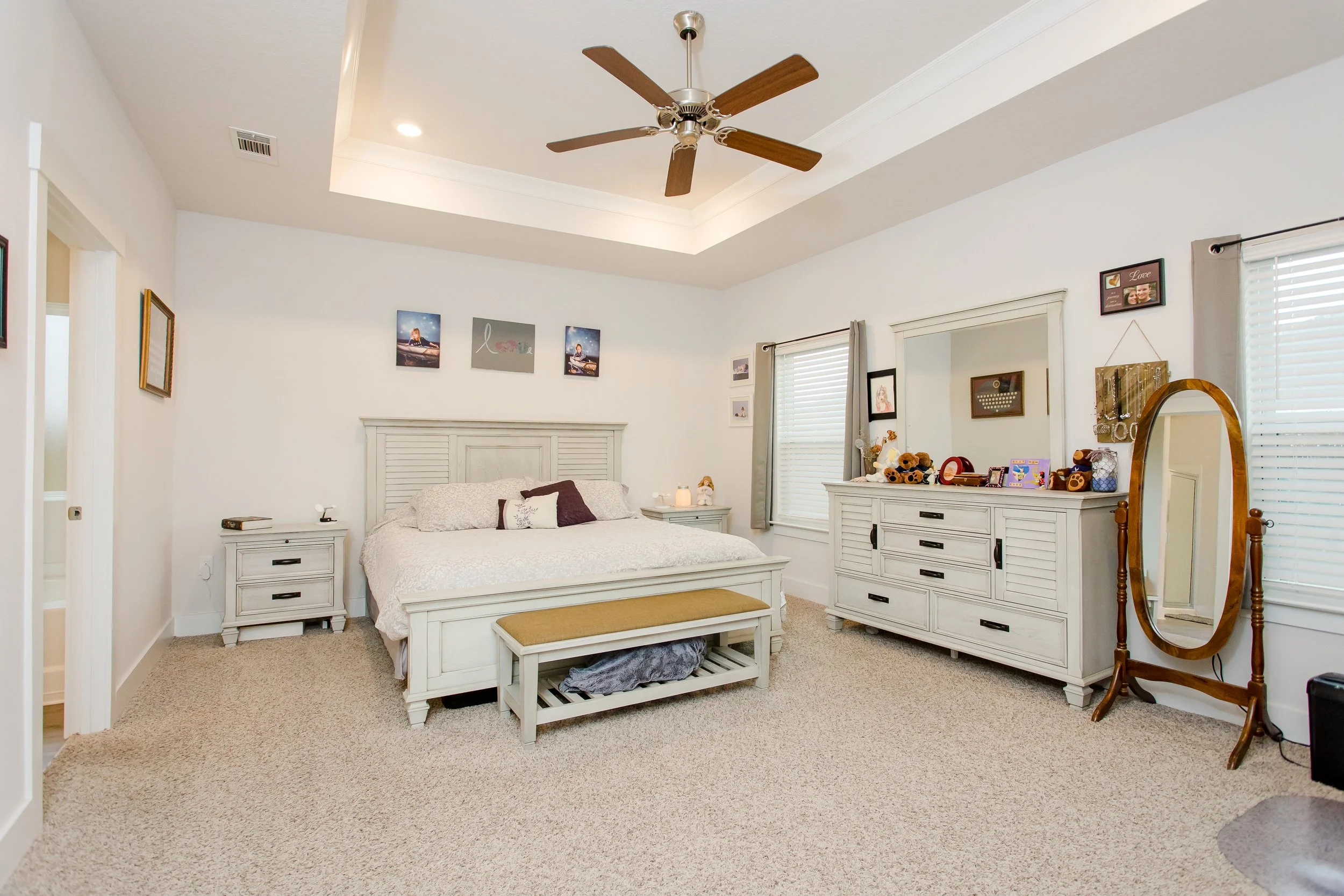 Professional real estate interior photography featuring a bright primary bedroom prepared for a home listing