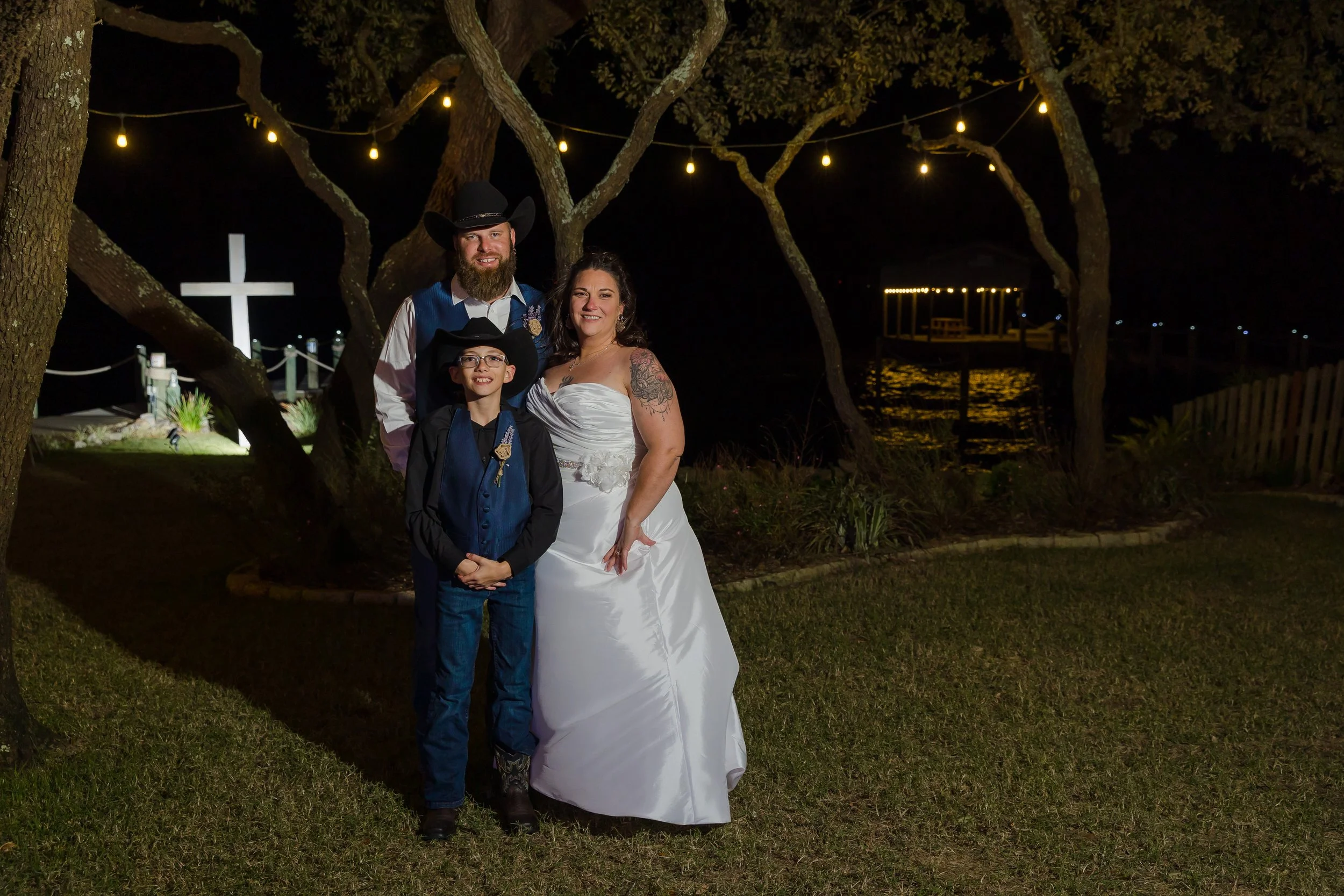 Bridal party family images on the lawn at the Bay Front Lodge and Log Cabin in Gulf Breeze picture taken by Jacksonville Beach and St. Augustine Wedding Photographer