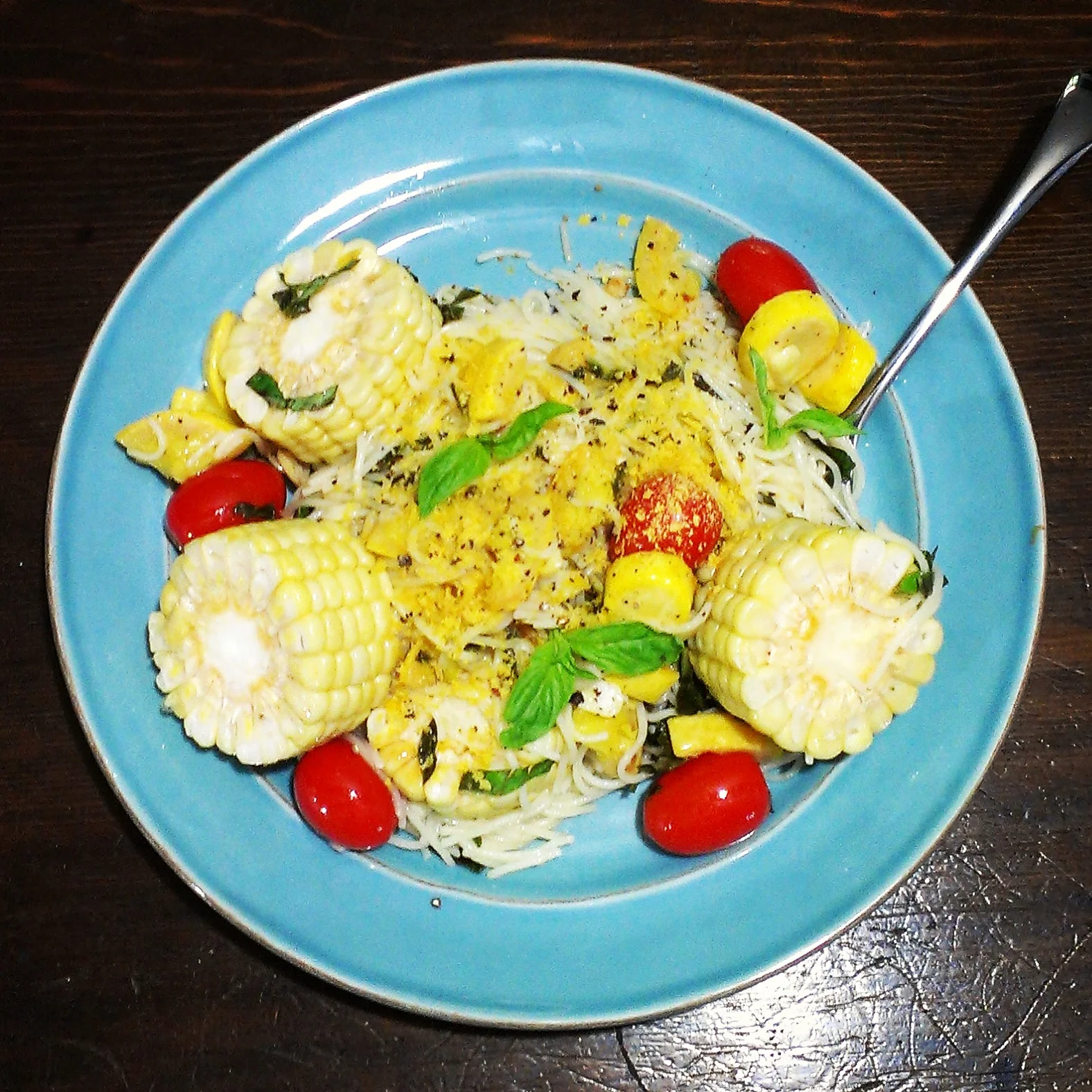 angel hair pasta in lemon cream sauce, cherry tomatoes, garlic, summer squash, corn on the cob, basil