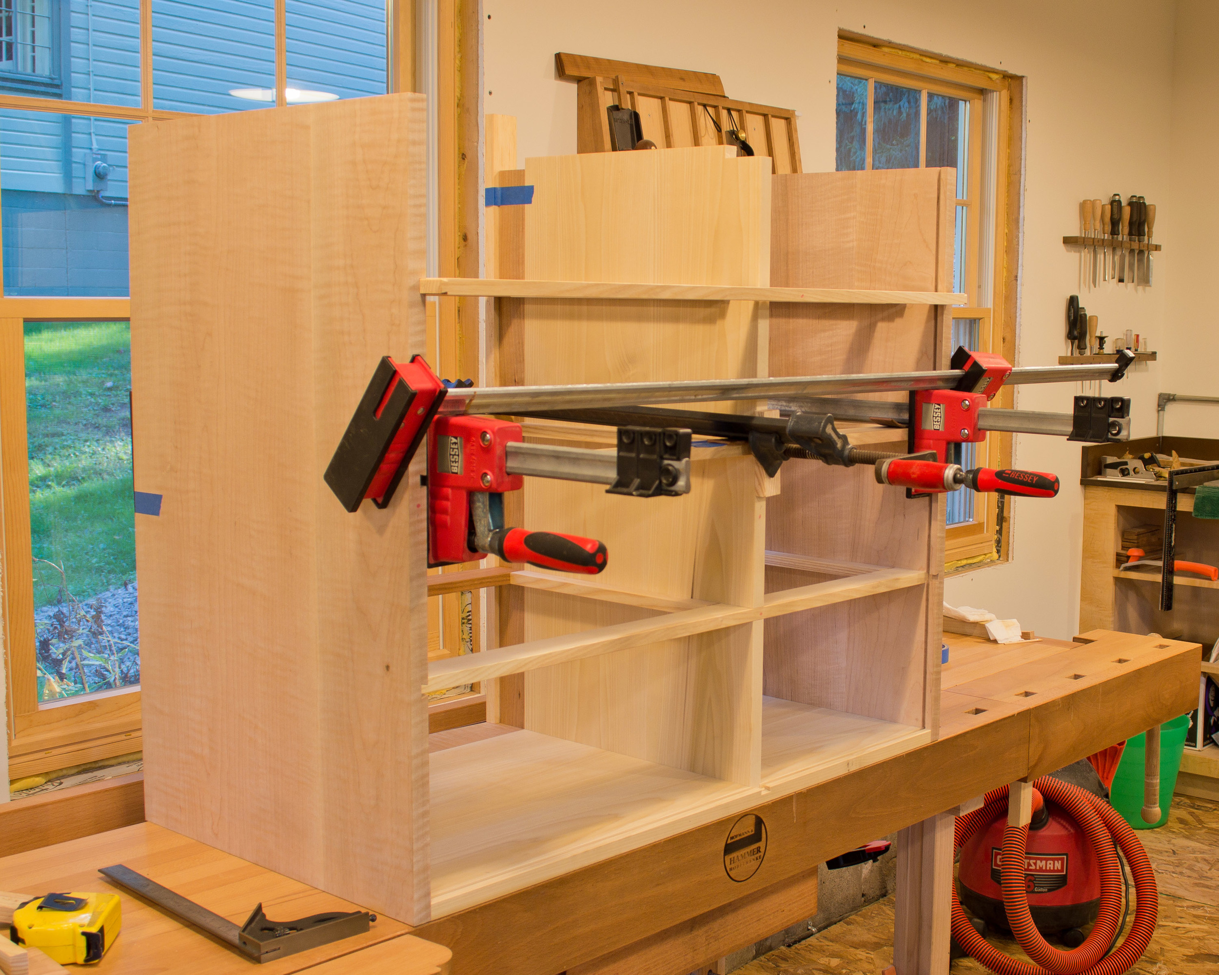  I'm using clamps to pull &nbsp;one of the rear horizontal dividers into position. &nbsp;Again, sliding dovetails and half laps. 
