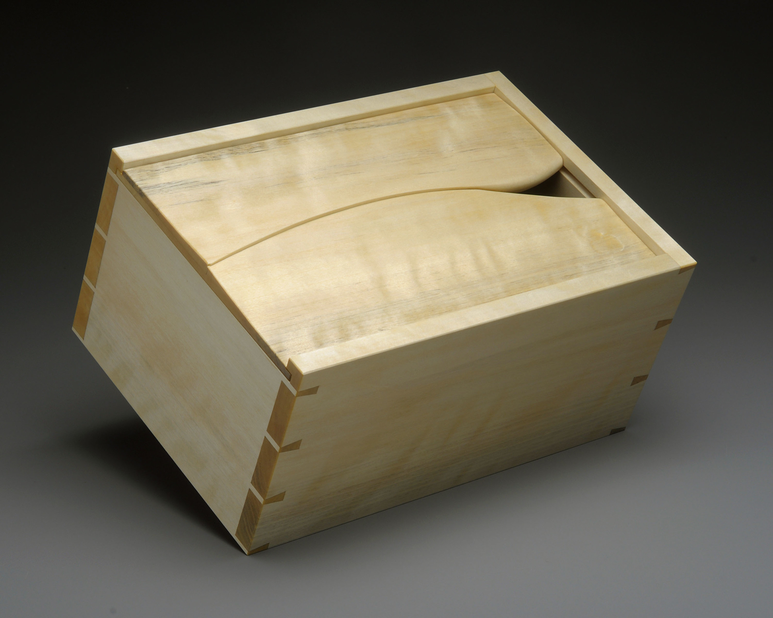  El Cubano   El Cubano? Well, someone suggested that the sculpted lid of this box makes it look like a fancy humidor. So I went with it and named it after a cigar. It is made of Yellow Birch, with a touch of flame figure.    7.5" W x 11" L x 5" D    