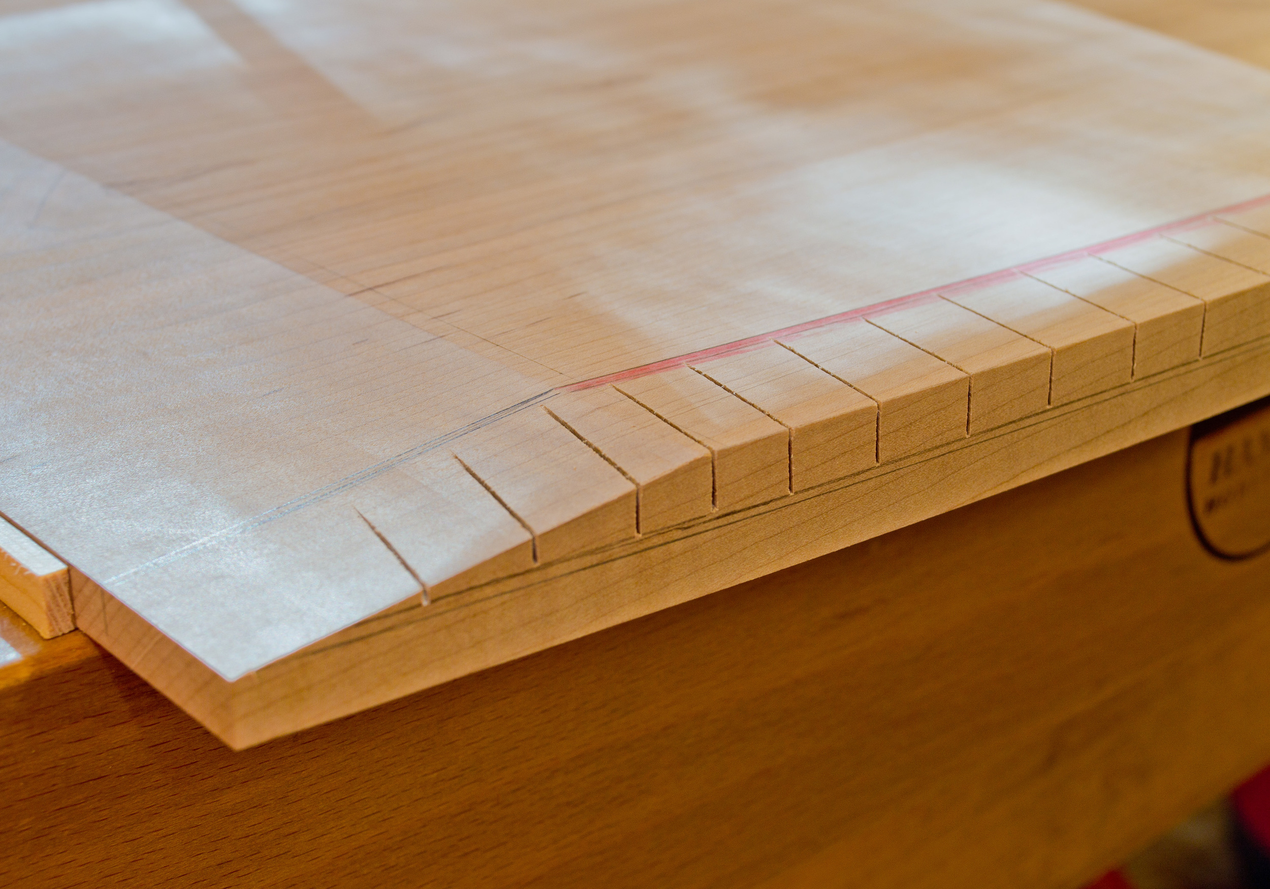  Close-up of the saw-kerfed edge. &nbsp;Notice the layout lines - they are so important in achieving the final shape. 