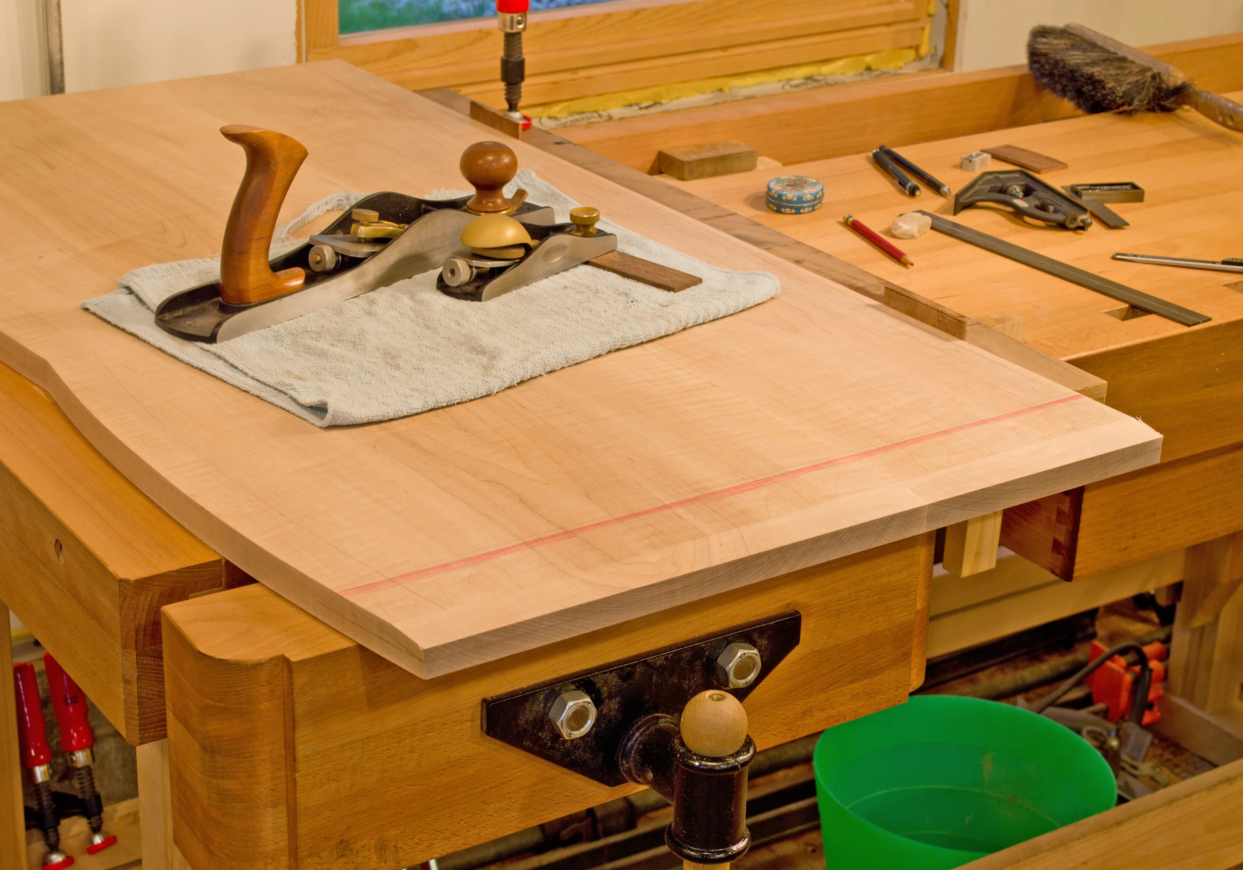 How did I shape the underbevels on this top? Hand planes. I take pretty aggressive cuts at this point, but will begin to work more precisely as I get closer to the layout lines