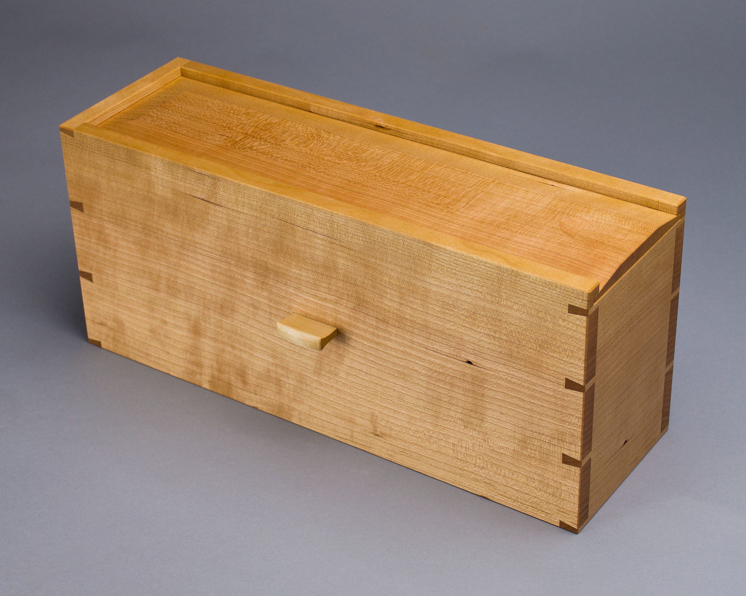  The hidden compartment, a dovetailed box made of quartersawn cherry. 