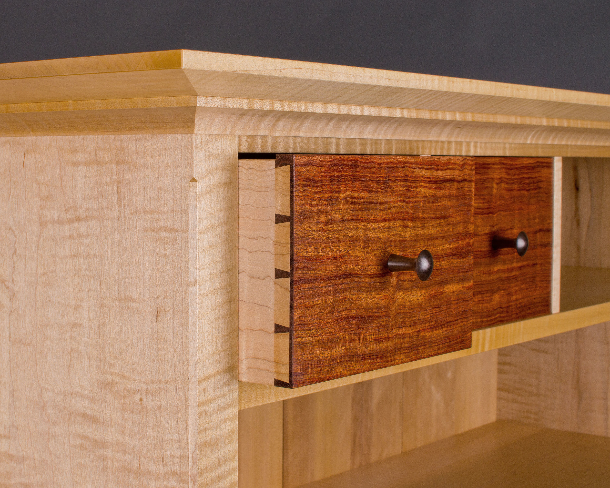 drawers feature hand-cut dovetail joints, the epitome of craftsmanship