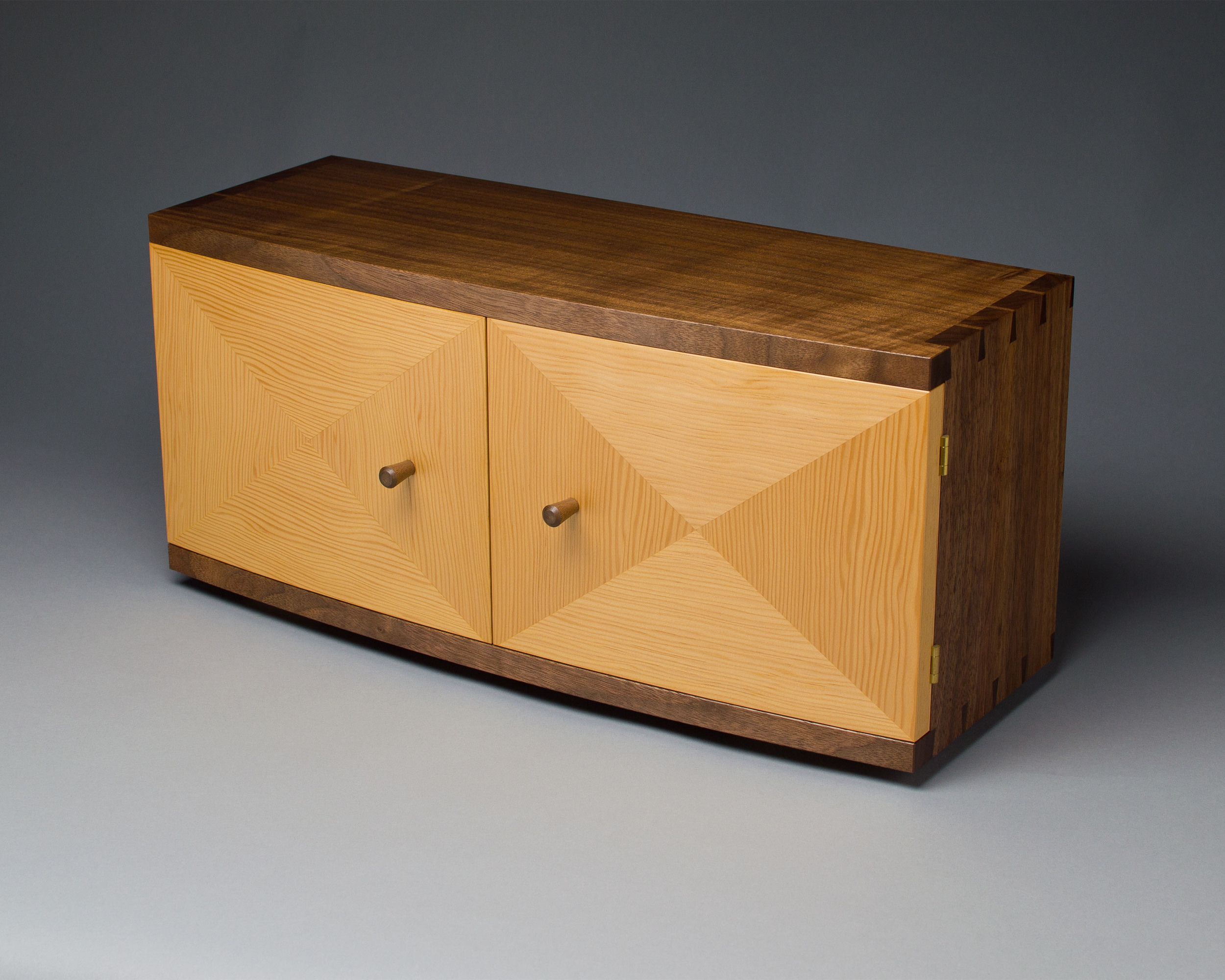 the cabinet case features hand cut dovetail joinery