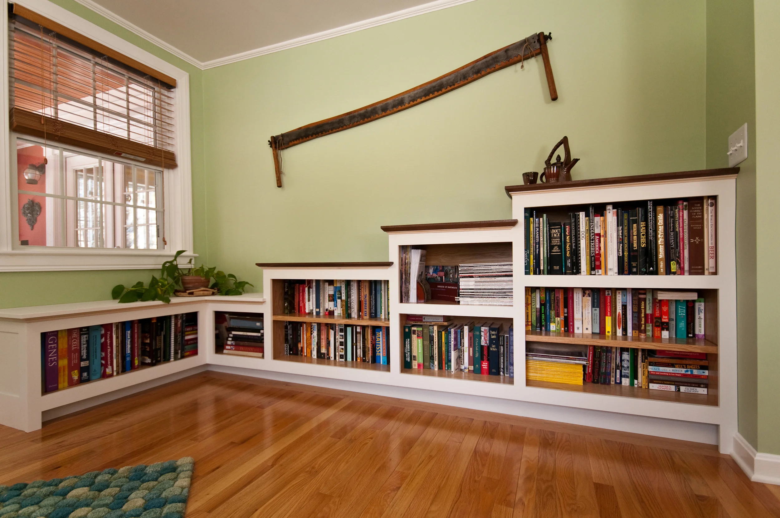 Built-in Bookcase The unique stepped design of this bookcase was a response to the challenges presented by the space in which they were built. They are made of cabinet grade oak plywood with hand planed black walnut tops. Photos by Michael Yacavone