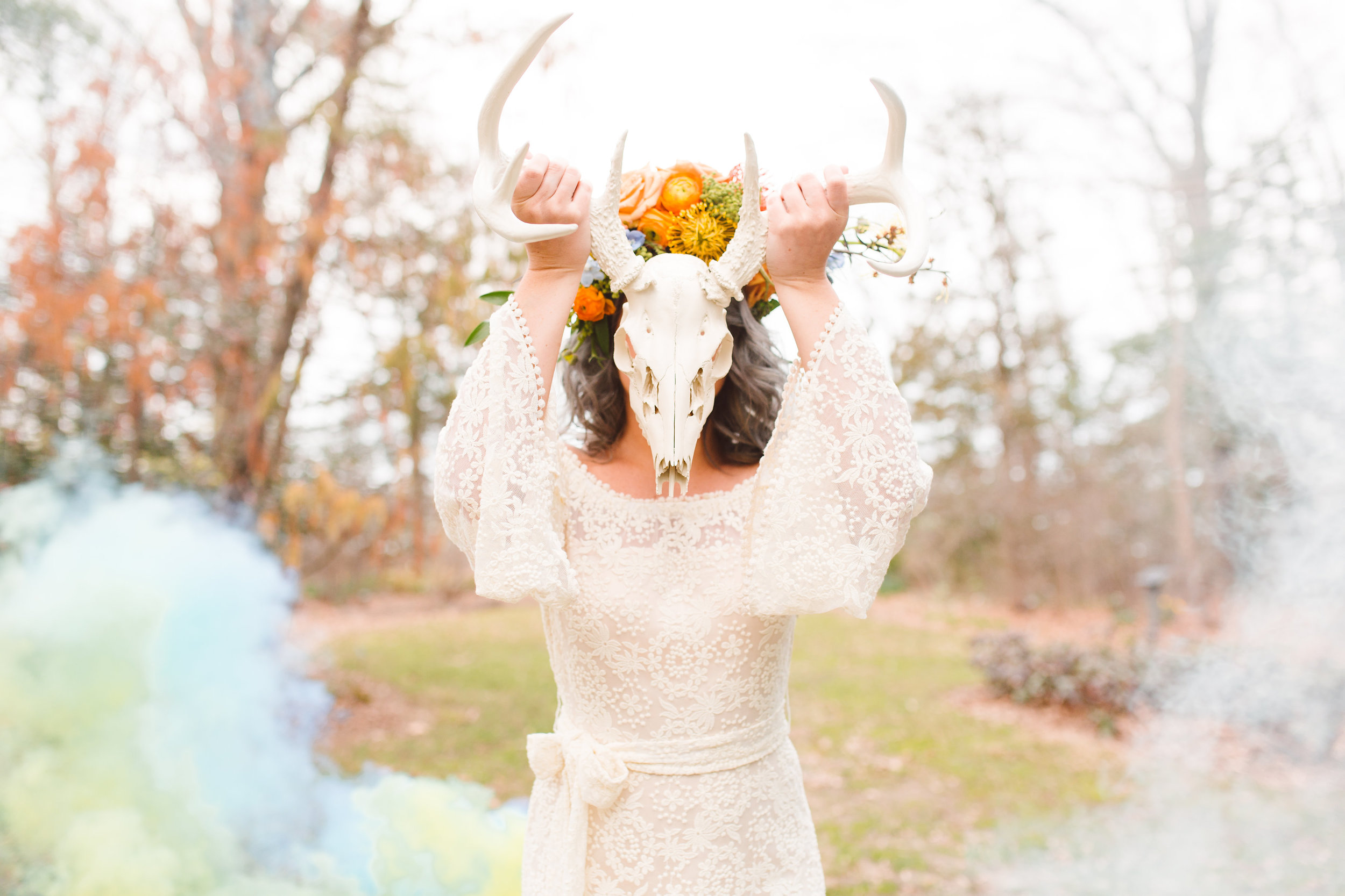 Boho Bride with deer skull and smoke bomb