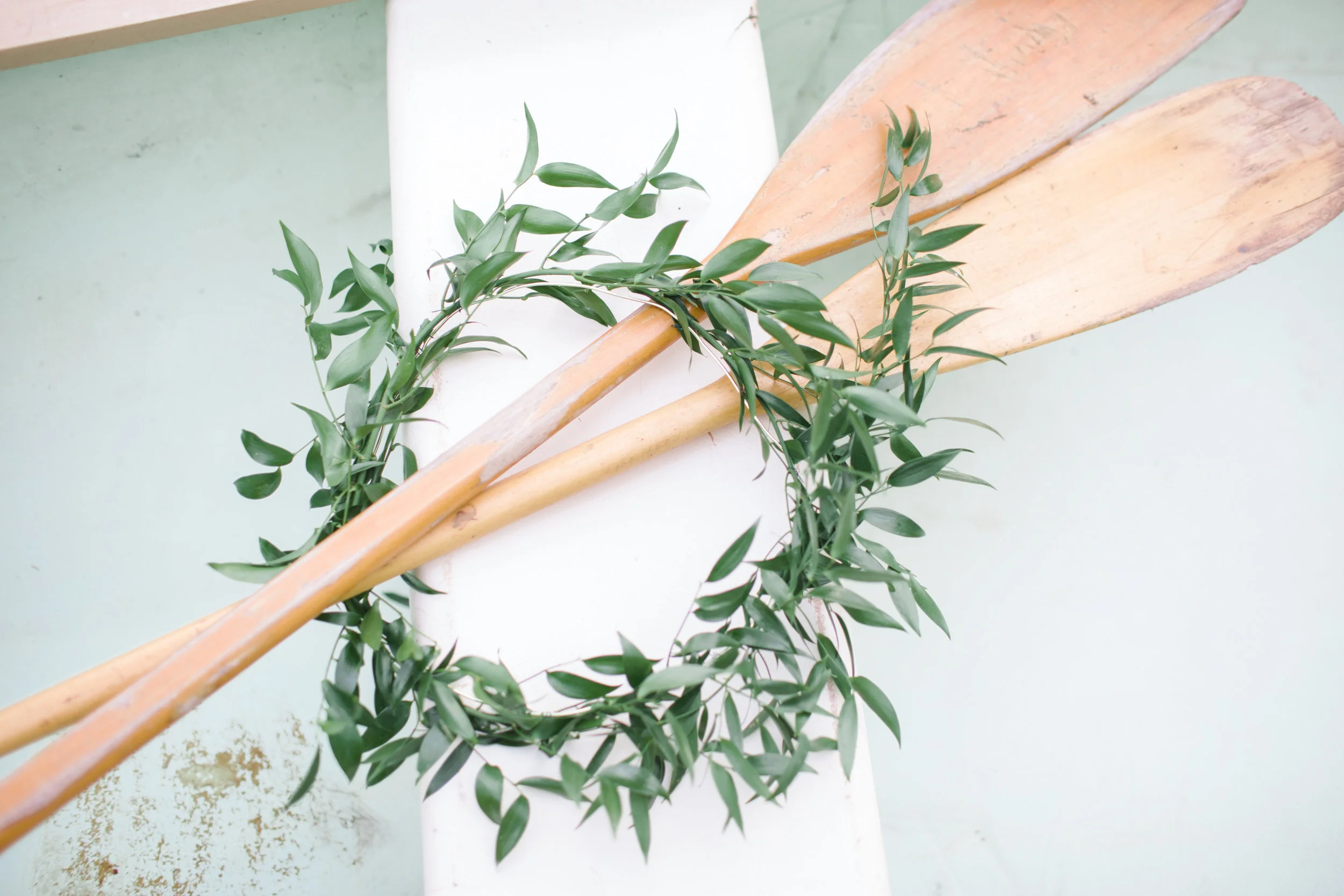 Oars with ruscus wreath
