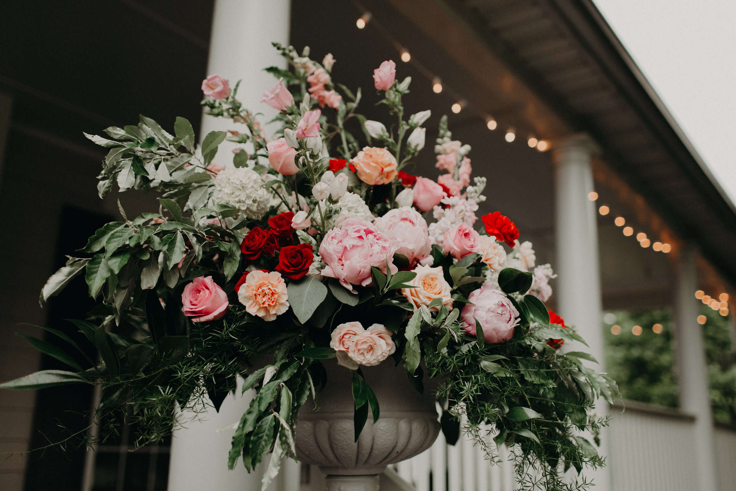 Pink and Red wedding ceremony flowers