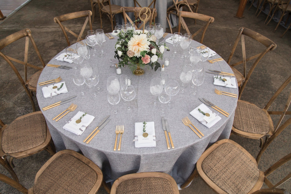 Round table with gray linen at Tranquility Farm
