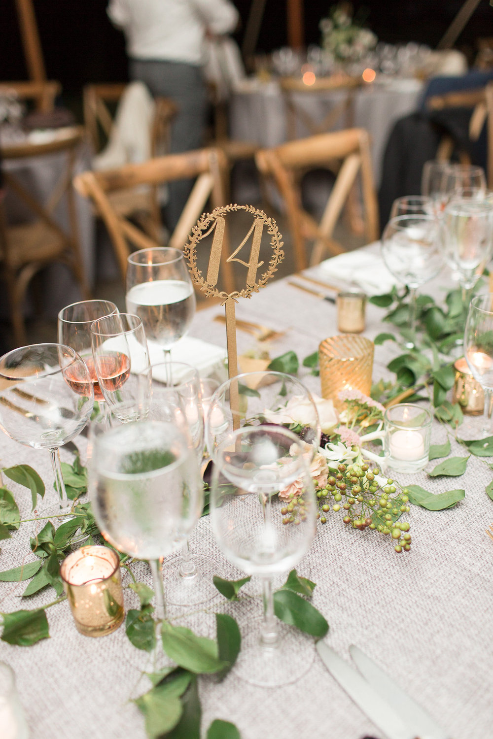 Centerpiece of garland, flowers, candles at Tranquility Farm in Purcellville, VA