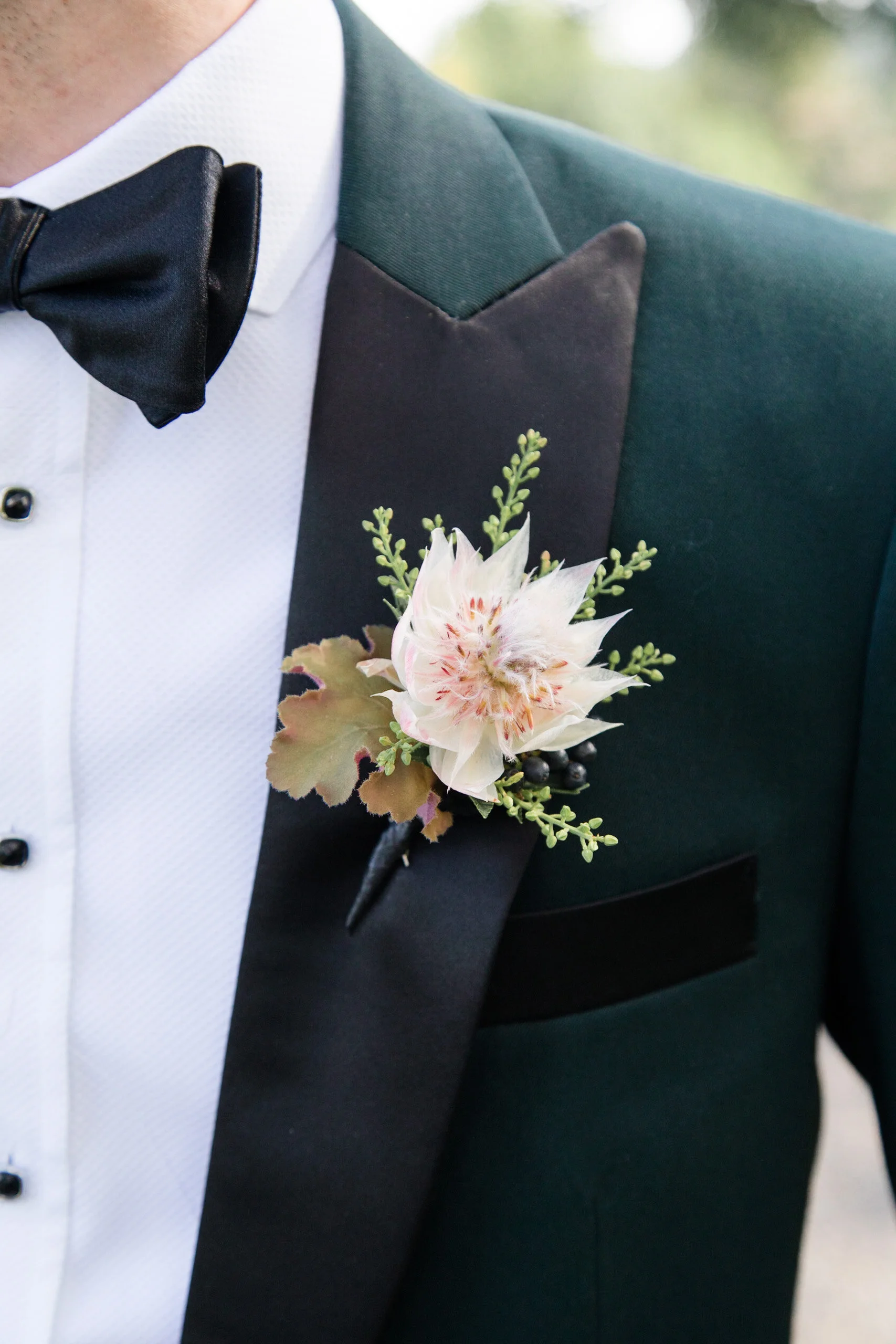 blushingbrideproteaboutonniere.jpg