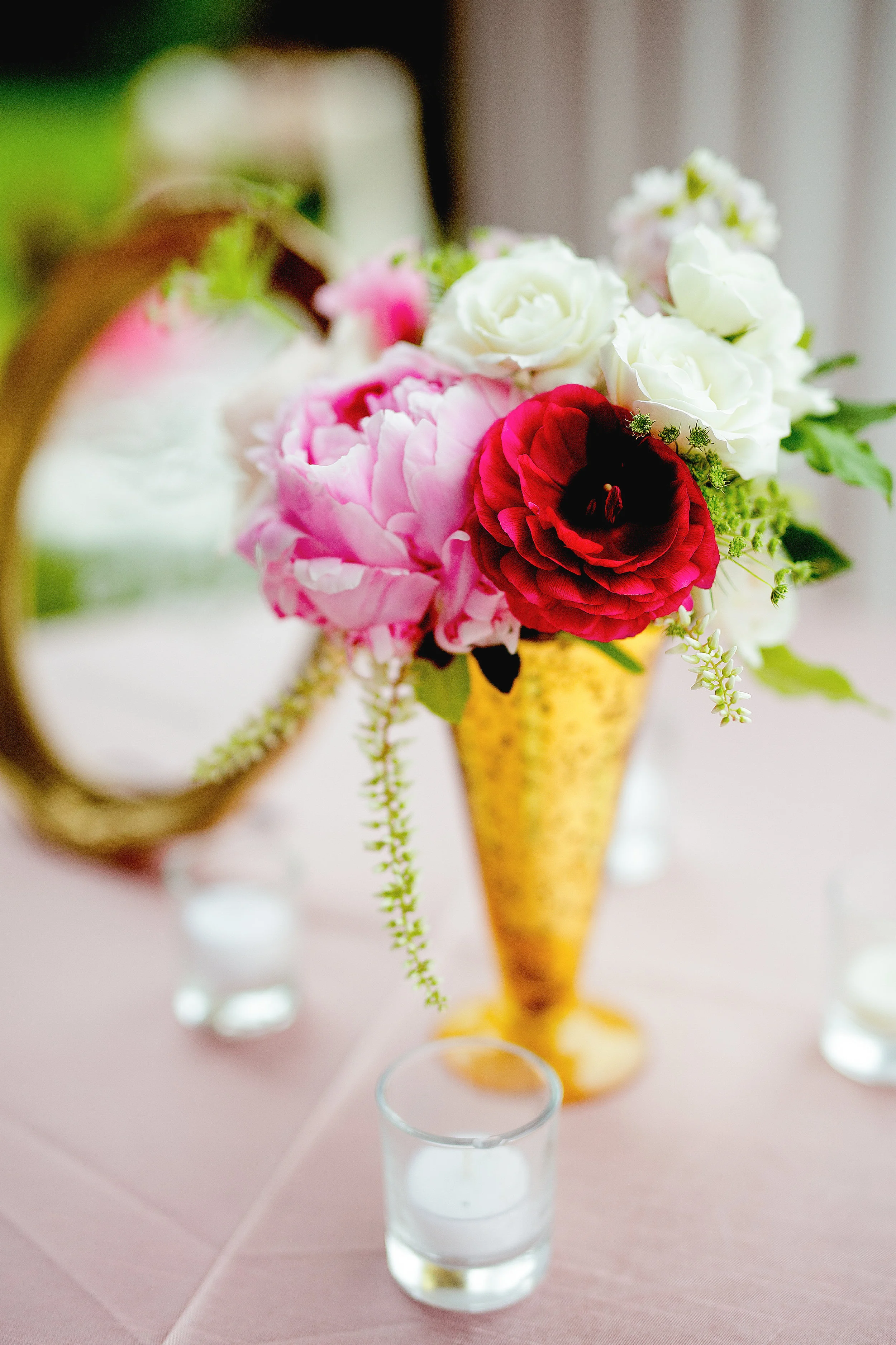 Cocktail flowers in gold vase