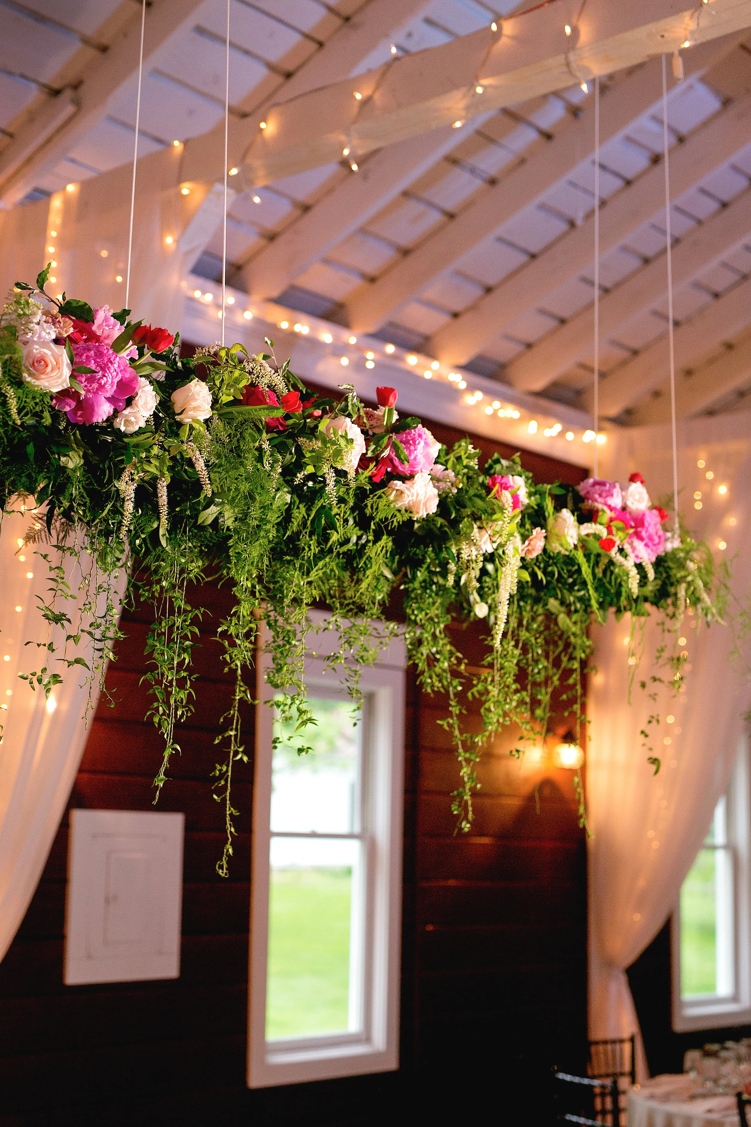 Floral installation above sweetheart table by Lark Floral at Historic Rosemont Manor