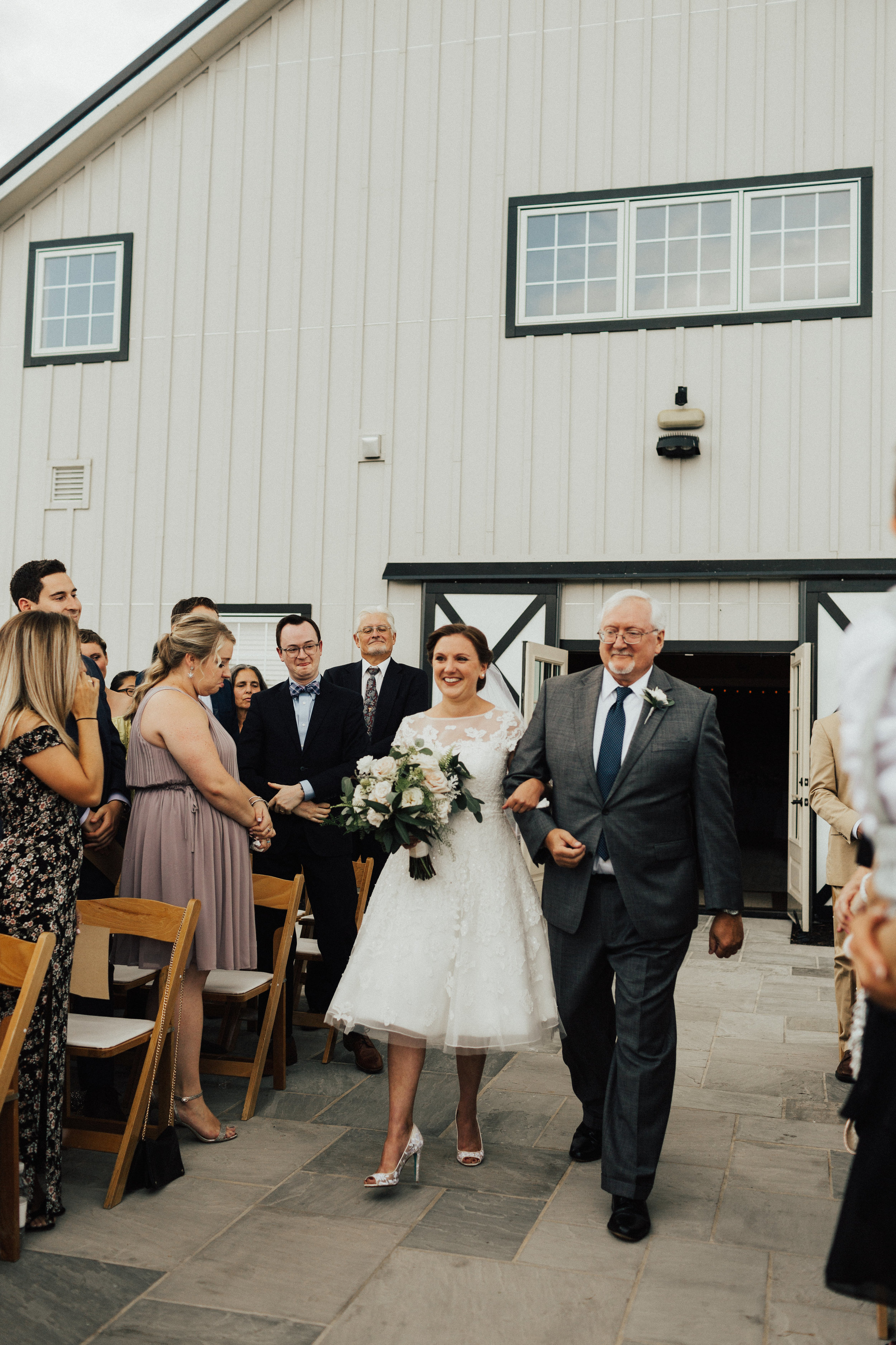 Bride and Father walk down aisle