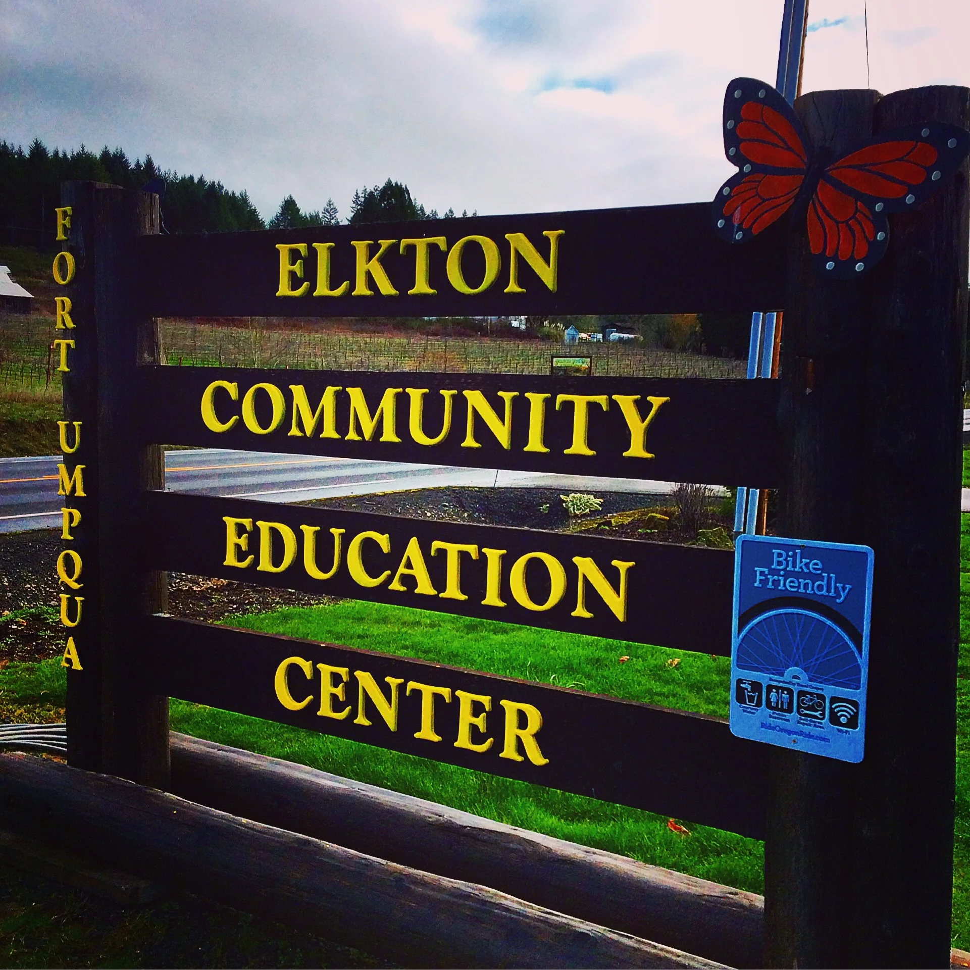 Entrance sign on Hwy 38 with Gillirose Vineyard in the background.