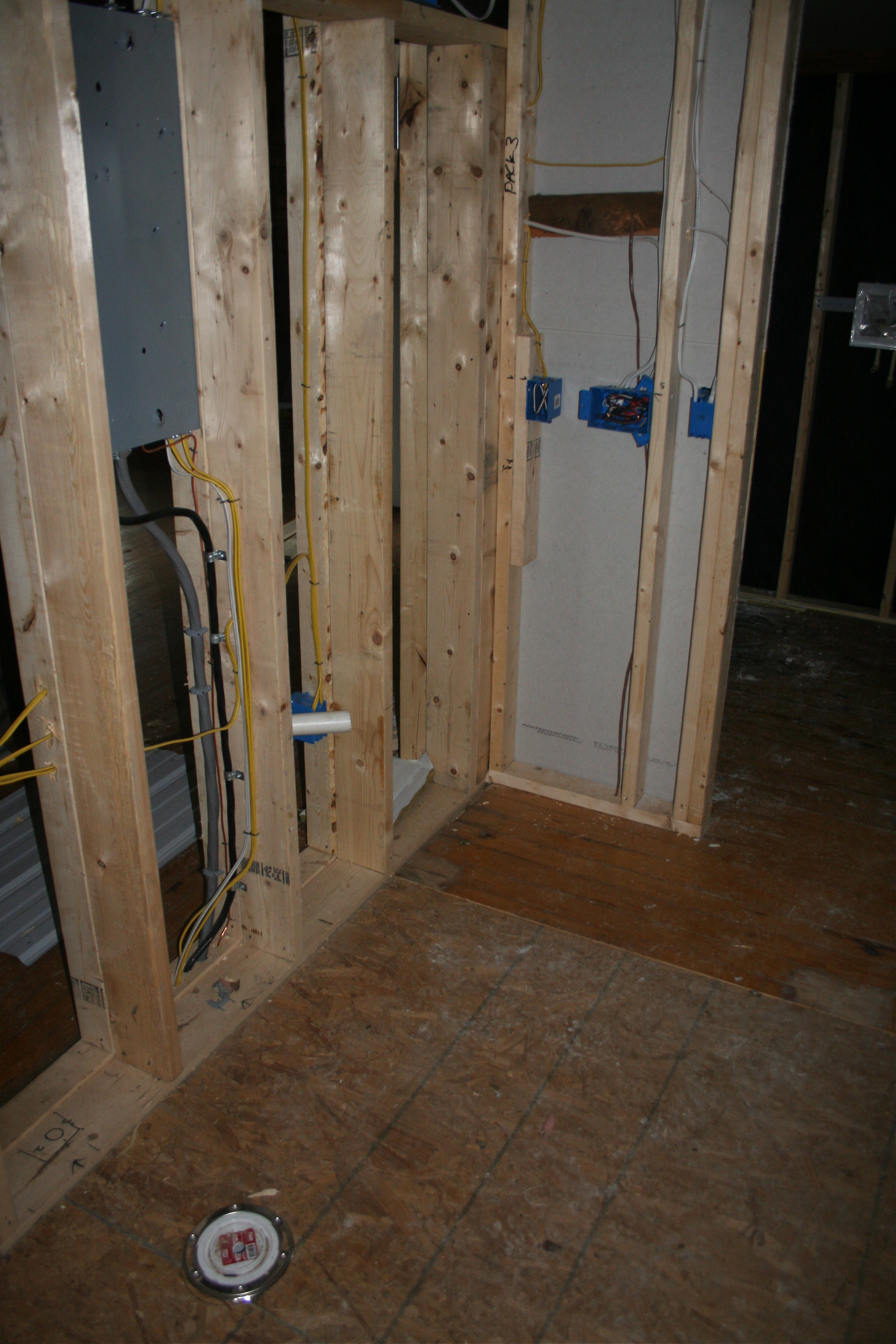 The toilet flange and the wall the vanity will go against.