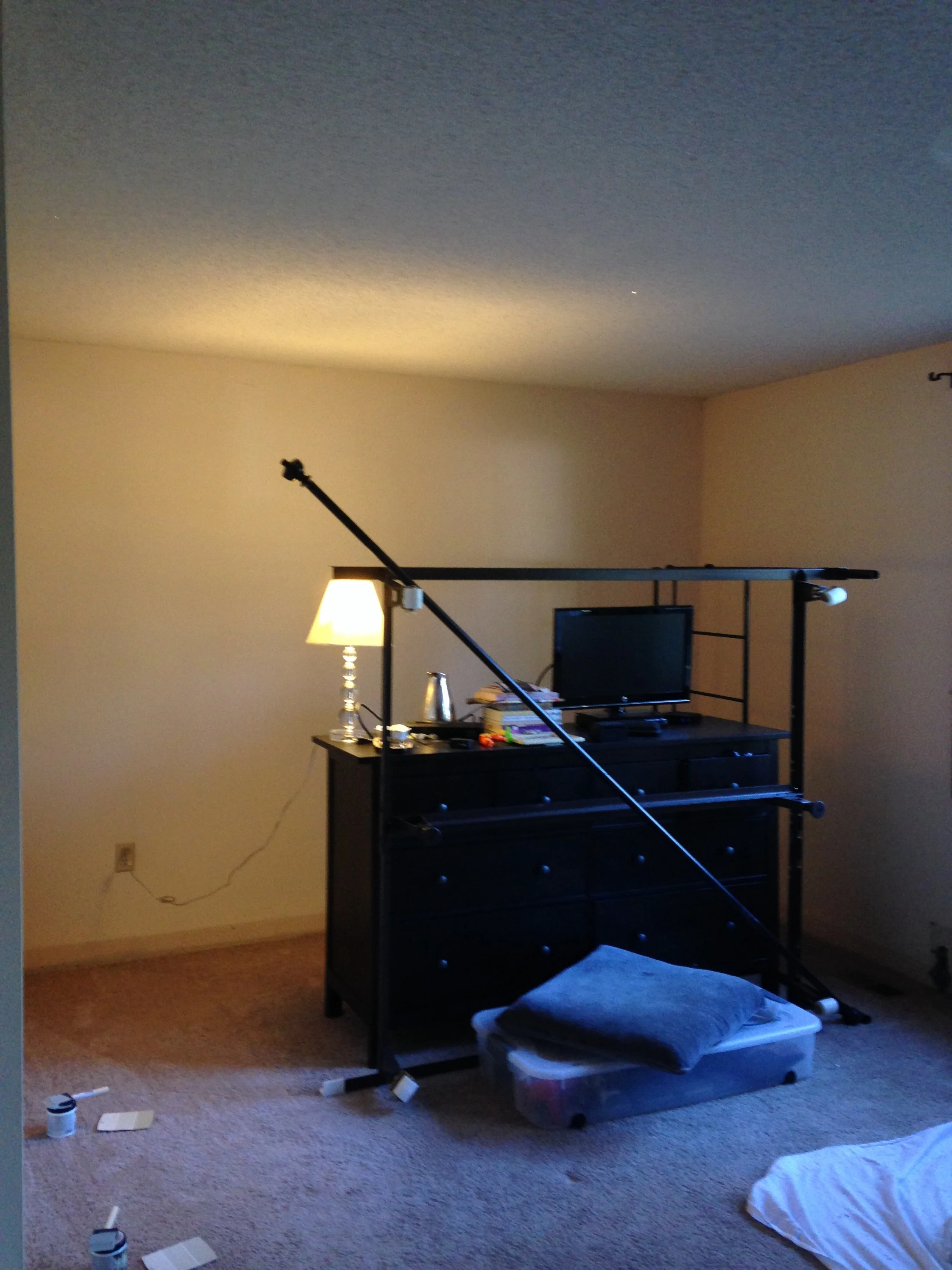 BEFORE: Master bedroom with popcorn ceilings, old carpet, original paint.