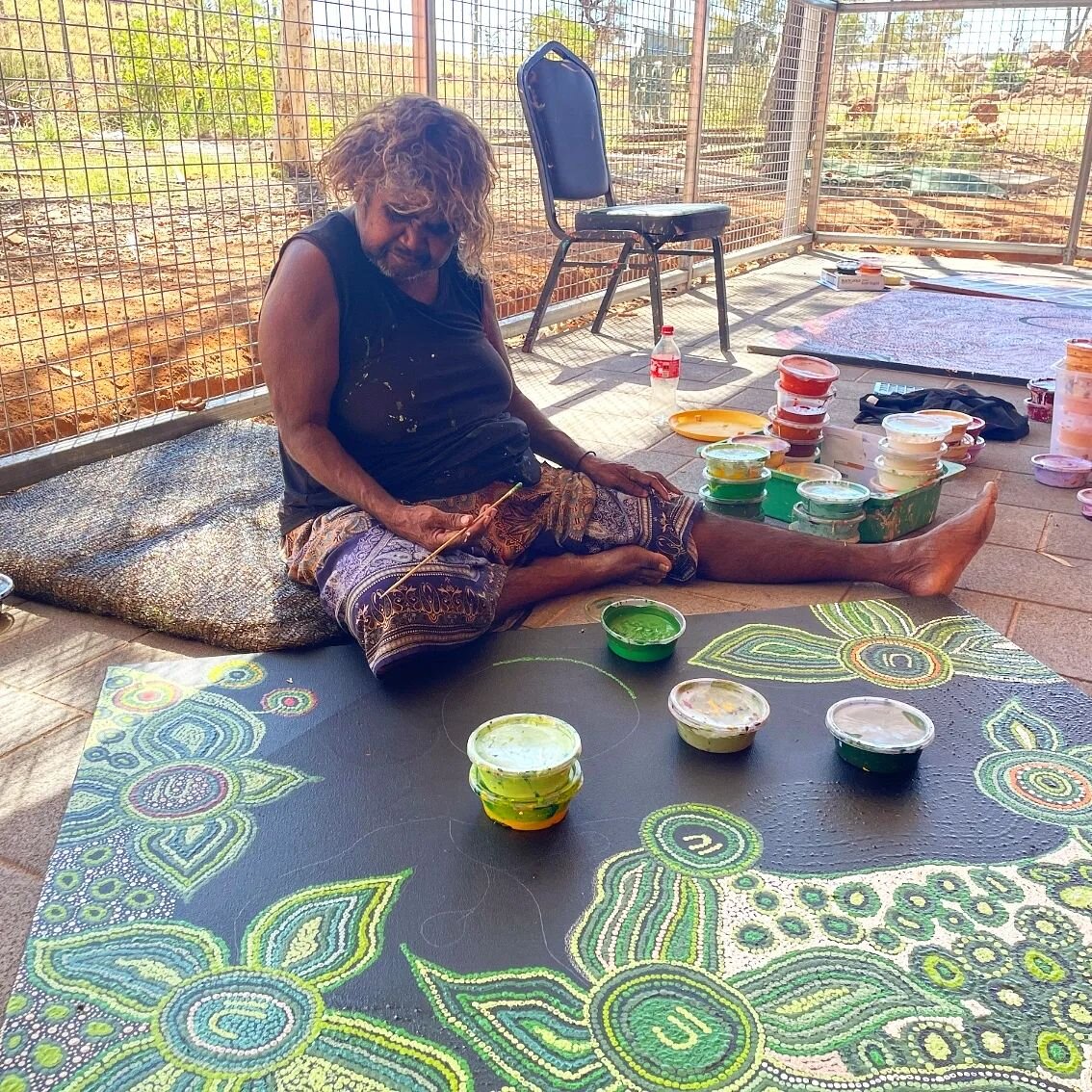 Ernabella artist Yanyi Dunn working in the new secure outdoor space created as part of the Tjukurpa Kunpu (Strong Stories) Museum project.

The federal government's IVAIS program provided funding for the new building and this wonderful outdoor area l