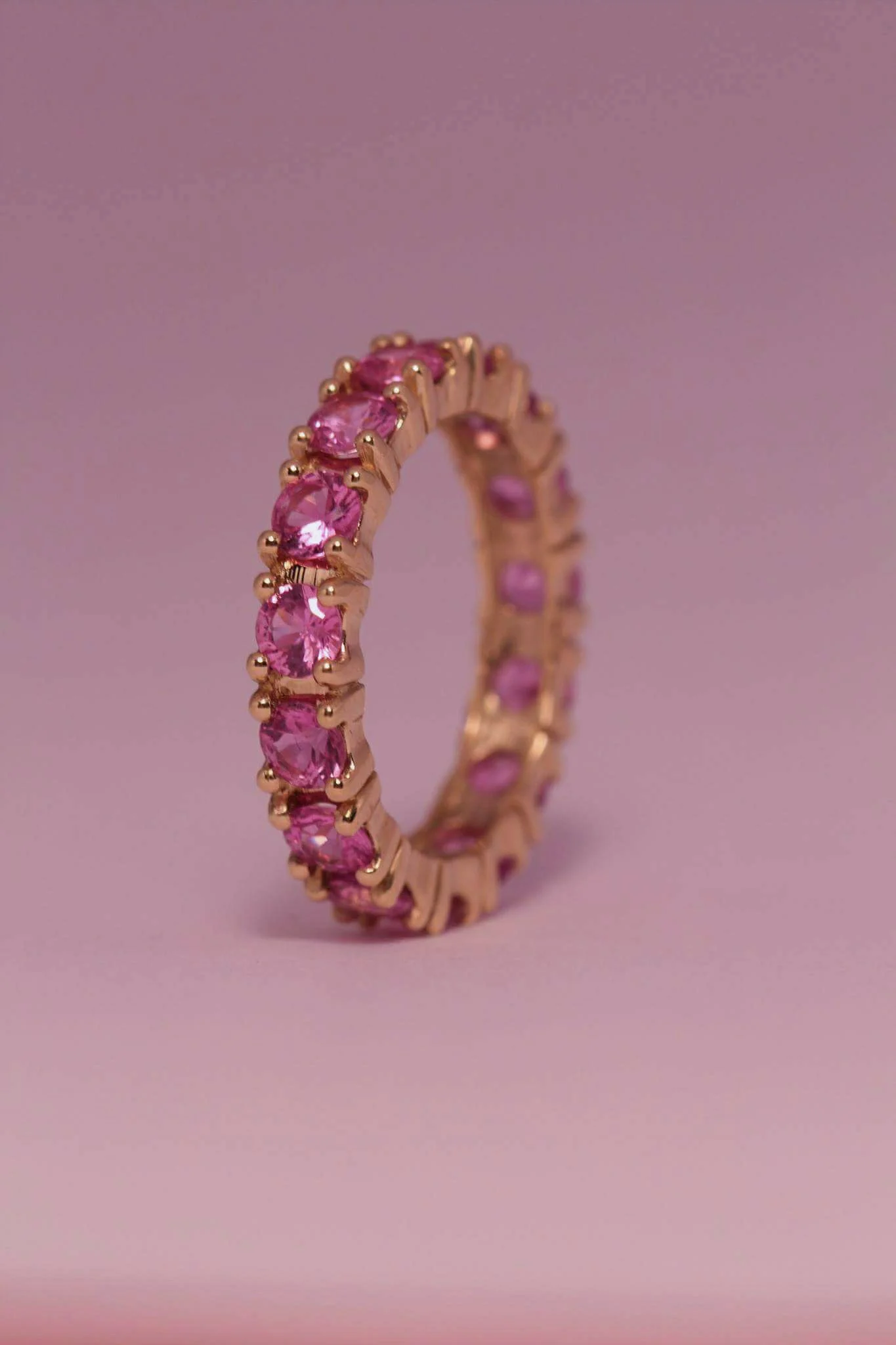 14k yellow gold eternity ring pink sapphire.jpg