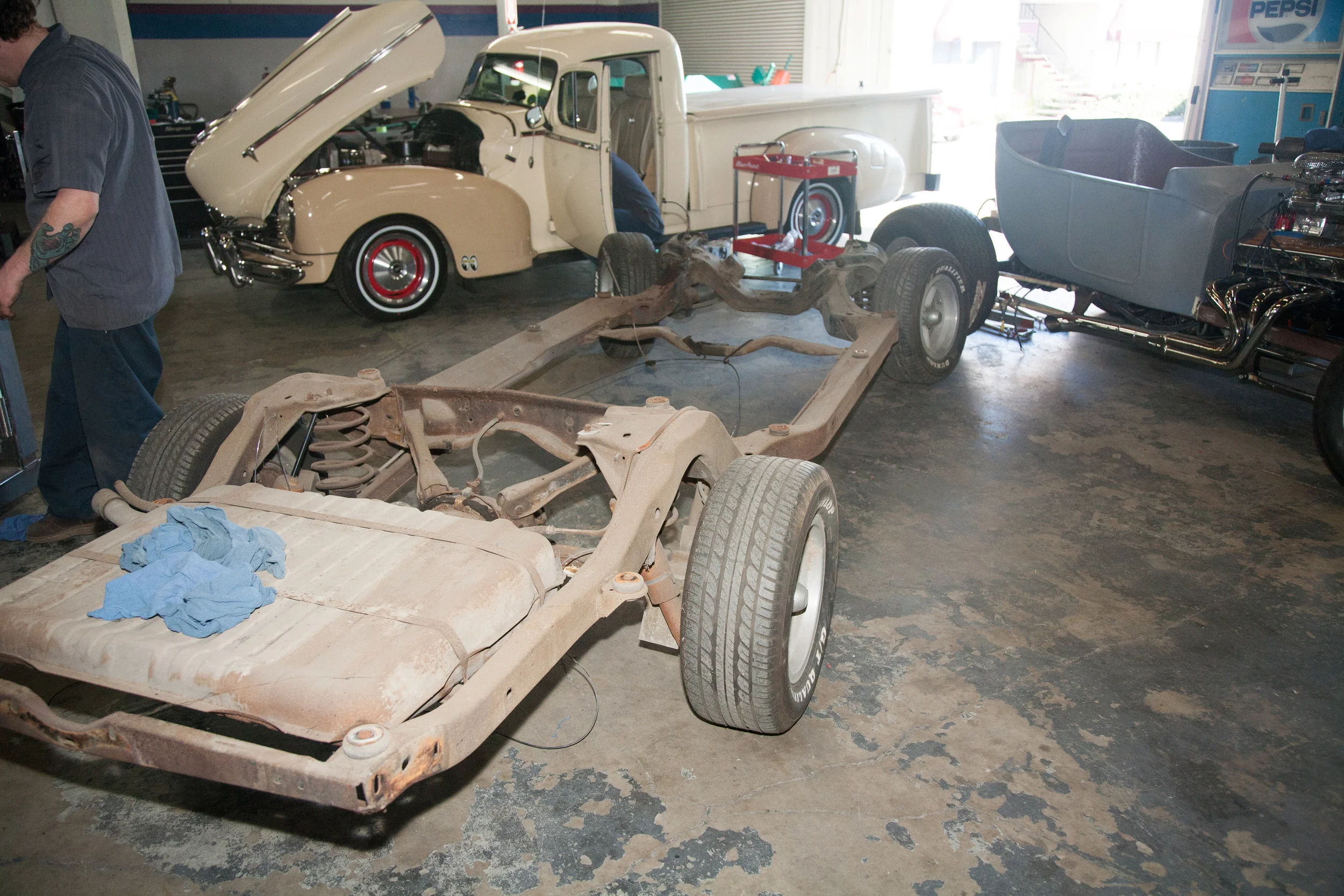 The chassis is rolled away to be taken apart, inspected for any damage and sent out to be sandblasted and powdercoated.