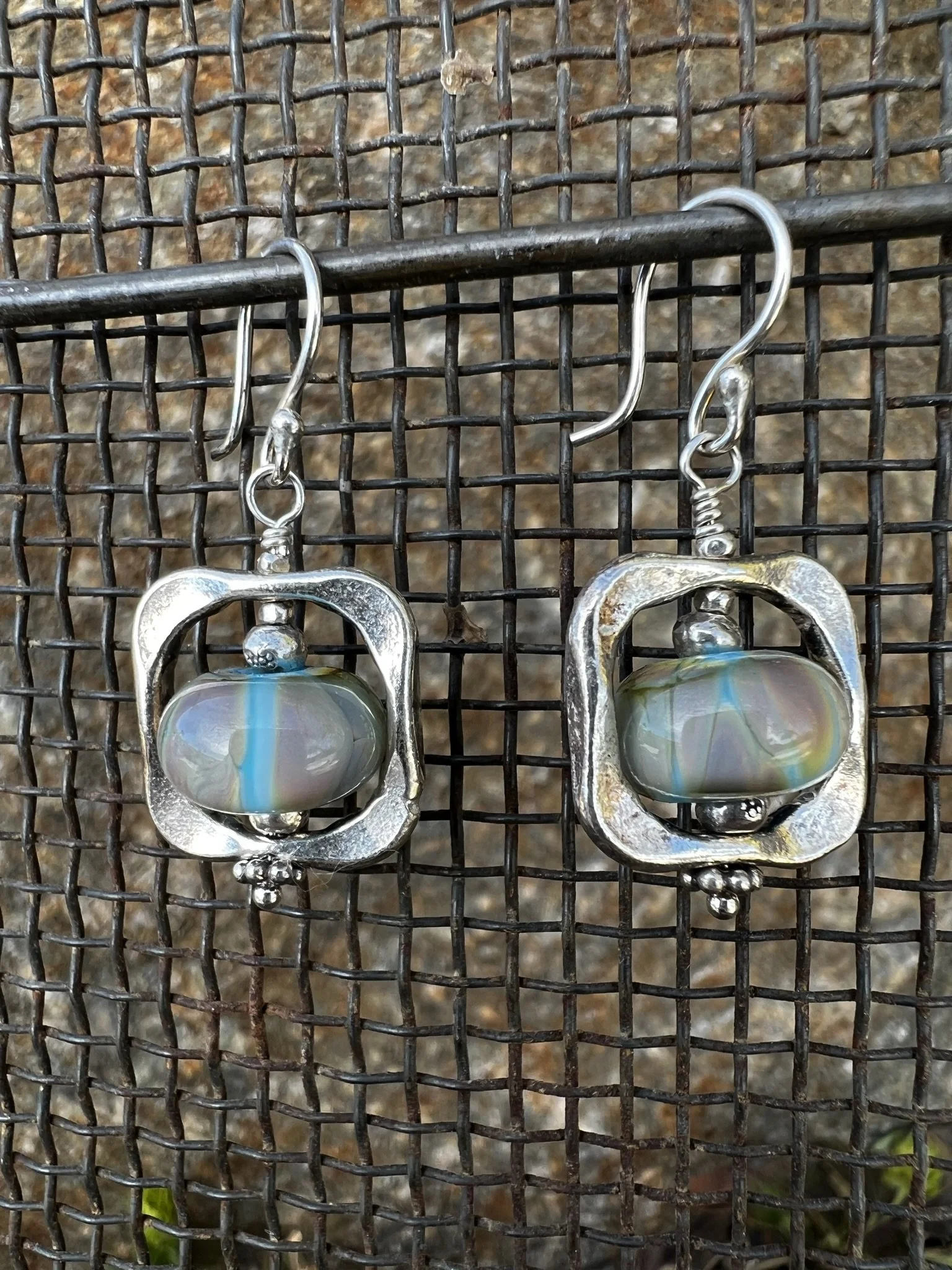 Handmade lampwork glass artist earrings made by Mallory square Studios.
