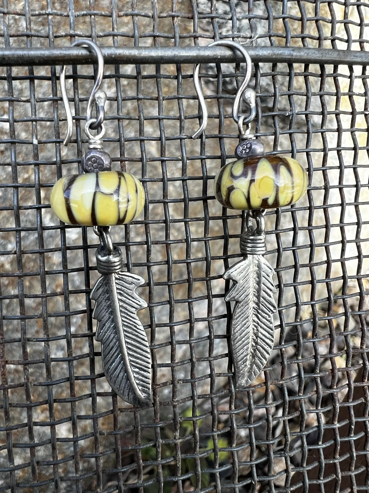 Feather and glass earrings