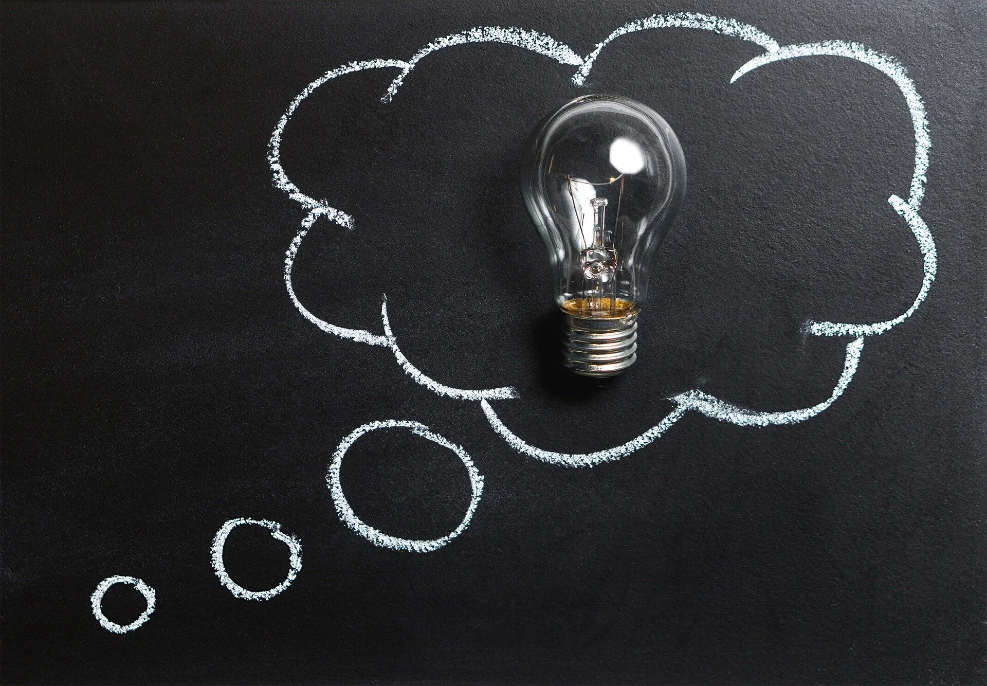 a lightbulb in a thought bubble.